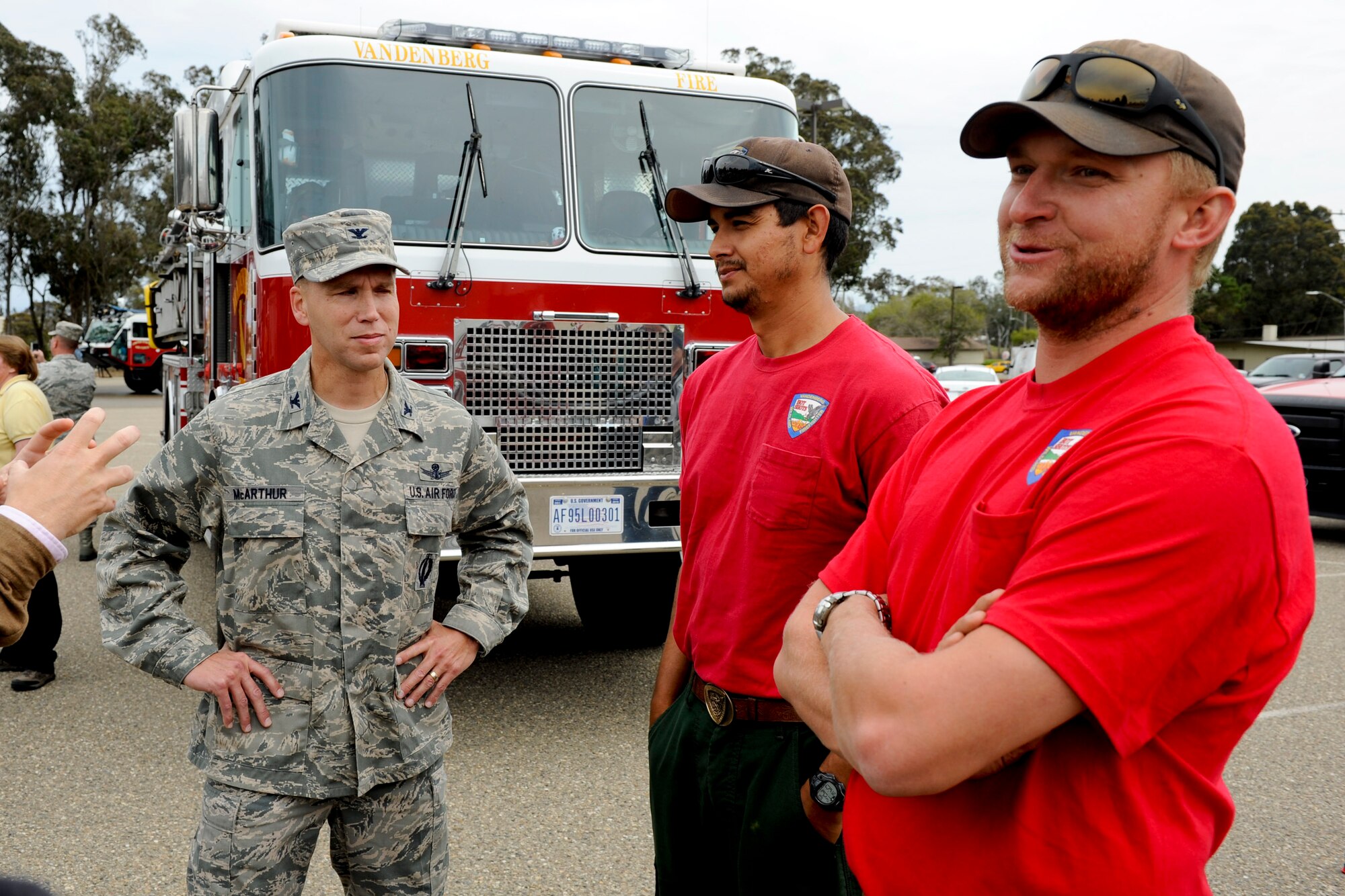 VANDENBERG AIR FORCE BASE, Calif. -- Col. Brent McArther, 30th Space Wing vice commander, speaks with members of the Vandenberg Hot Shots outside the Pacific Coast Club here after they returned from fighting wildfires in Colorado and Wyoming Thursday, July 12, 2012. Wildfires in Colorado and Wyoming burned 29,168 acres total and destroyed nearly 350 houses in Colorado. (U.S. Air Force photo/Staff Sgt. Levi Riendeau)