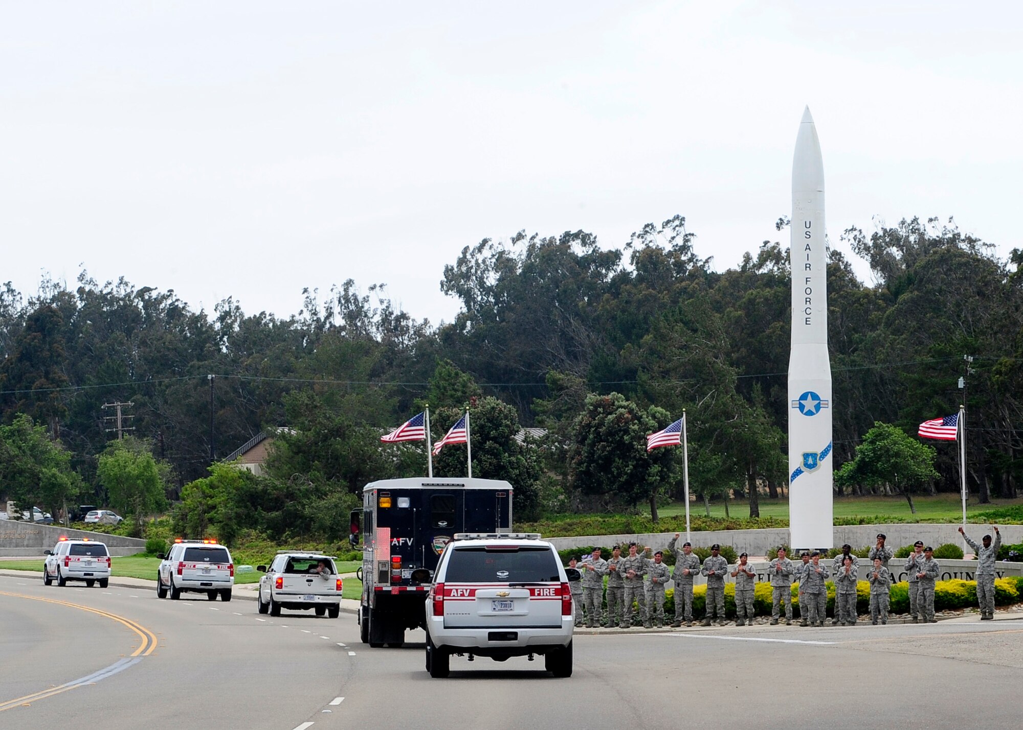 VANDENBERG AIR FORCE BASE, Calif. ? Vandenberg Hot Shots receive are welcomed by 30th Security Forces Squadron members as they arrive home Thursday, July 12, 2012. Eighteen Hot Shots members were sent from Vandenberg AFB to help fight wildfires in Colorado and Wyoming which burned 29,168 acres total and destroyed nearly 350 houses in Colorado. (U.S. Air Force photo/Michael Peterson)