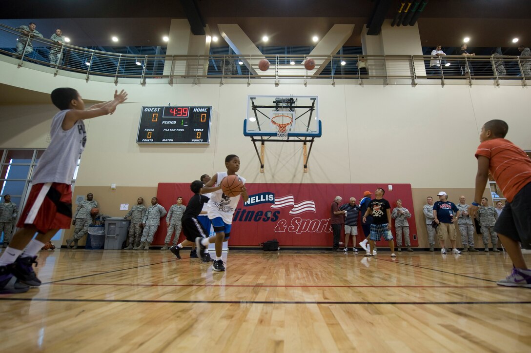 Children from the Nellis Community participate in a basketball clinic sponsored by the NBA in the Warrior Fitness Center July 10, 2012, at Nellis Air Force Base, Nev. More than 75 children ages 6-15 participated in the clinic taught by  NBA/WNBA players Lenny Wilkins, Gary Payton, Jerome Williams, Chris Muillin, Spencer Haywood and Teresa Edwards. (U.S. Air Force photo by Airman 1st Class Daniel Hughes)
