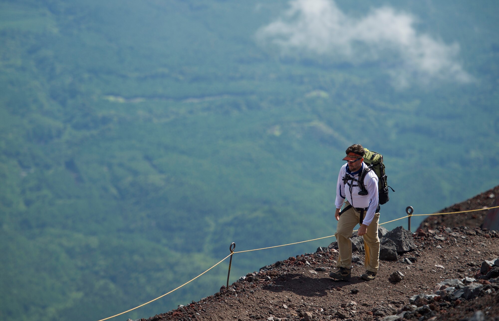 MOUNT FUJI, Japan -- Christopher Whitener, Tama Hills director, hikes up Mount Fuji after taking a break at the 6th station on July 11, 2012. Whitener, whom has climbed Mount Fuji eight times, was assisting a hiking group from Outdoor Recreation. (U.S. Air Force photo by Staff Sgt. Chad C. Strohmeyer)