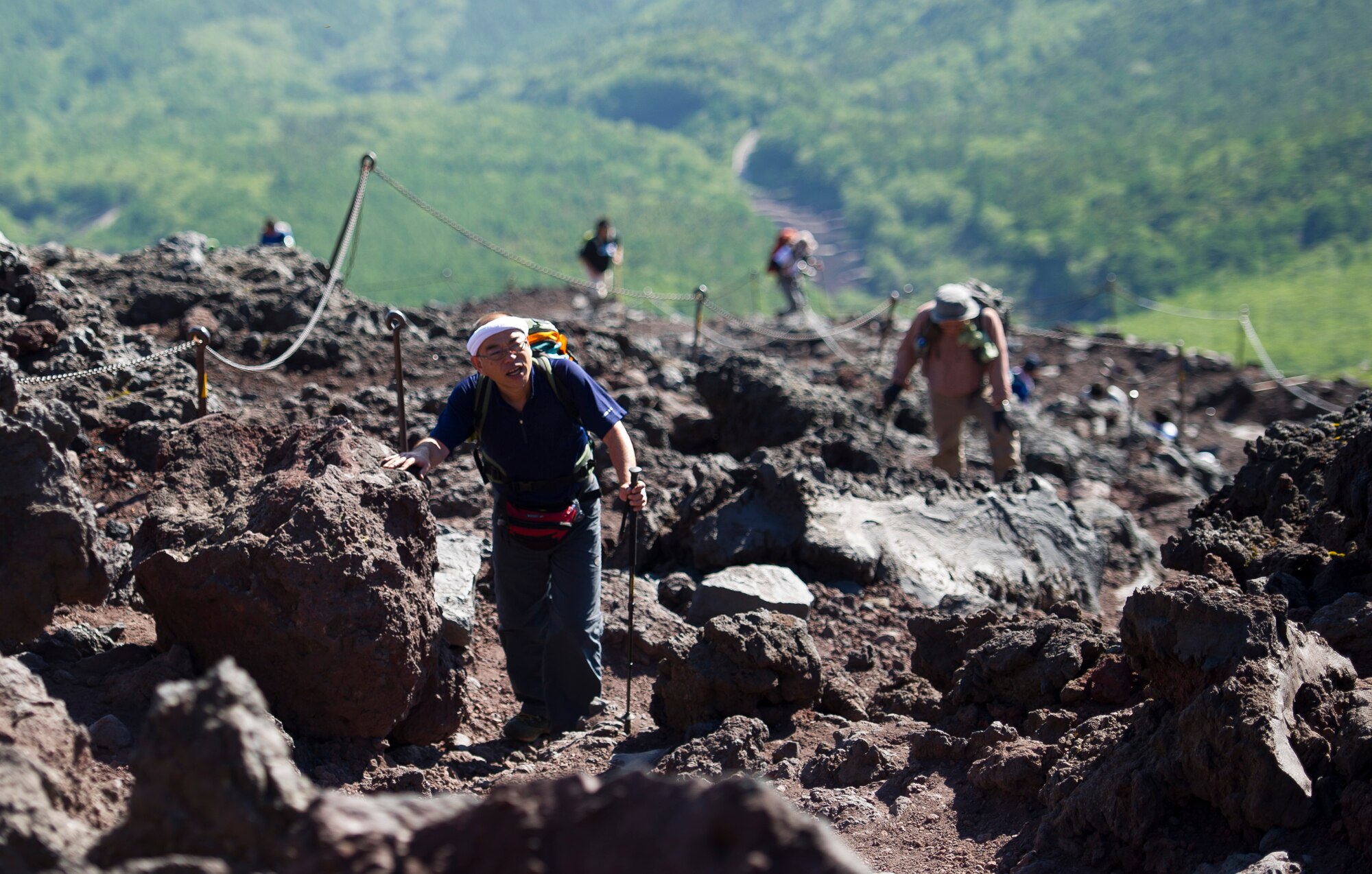 MOUNT FUJI, Japan -- A Japanese man stops to catch his breath on Mount Fuji, July 11, 2012. Due to weather conditions, the recommended hiking season for Mount Fuji is only from July 1 to August 31. (U.S. Air Force photo by Staff Sgt. Chad C. Strohmeyer)