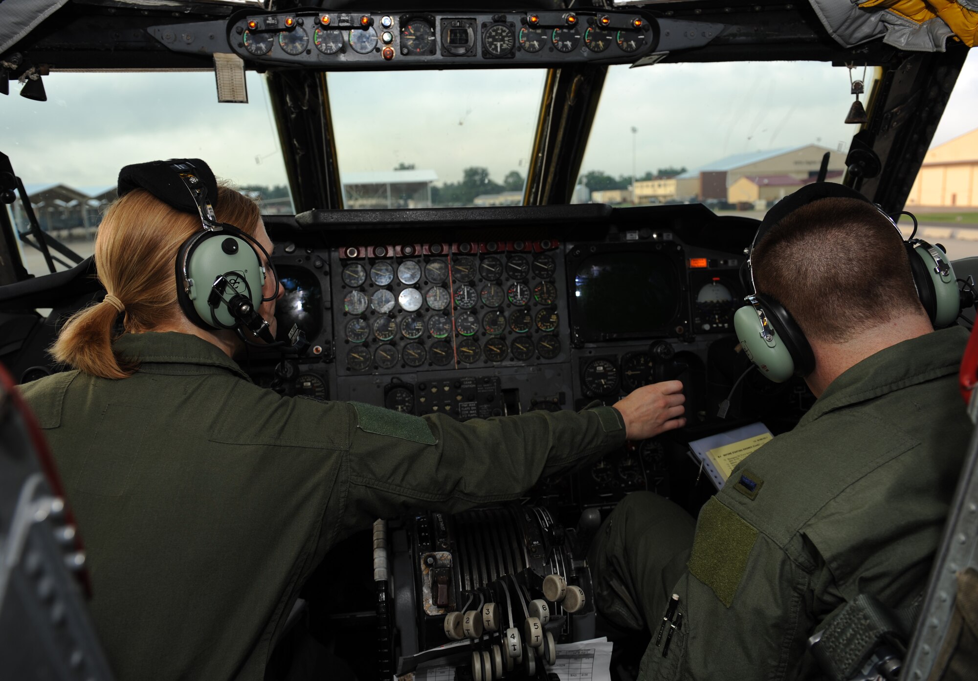 Capt. Christin Mastracchio and 1st Lt. Richard Pope, 11th Bomb Squadron Formal Training Unit Class 12-02 students, go over their pre-flight checklist before taking off on Barksdale Air Force Base, La., July 11. The students are supervised by FTU instructors as they perform their flight mission. A student's week consists of flight planning, simulator training and more than five hours of actual flying. (U.S. Air Force photo/Airman 1st Class Benjamin Gonsier)(RELEASED)
