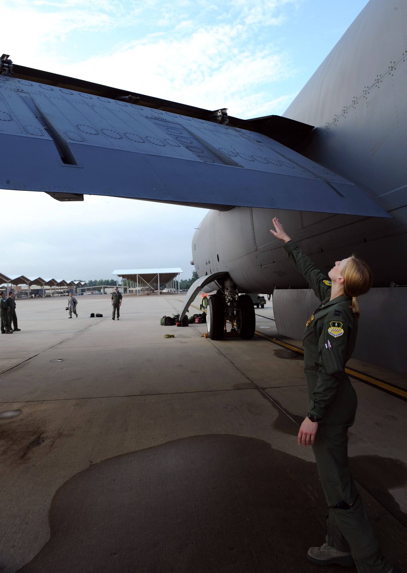 Capt. Christin Mastracchio, 11th Bomb Squadron Formal Training Unit Class 12-02 student, checks the wing flap of a B-52H Stratofortress on Barksdale Air Force Base, La., July 11. Before their flight, the aircrew received a briefing from the crew chiefs about the condition of the aircraft. Then the aircrew inspected their aircraft with an instructor present, giving them guidance on what to look for. (U.S. Air Force photo/Airman 1st Class Benjamin Gonsier)(RELEASED)
