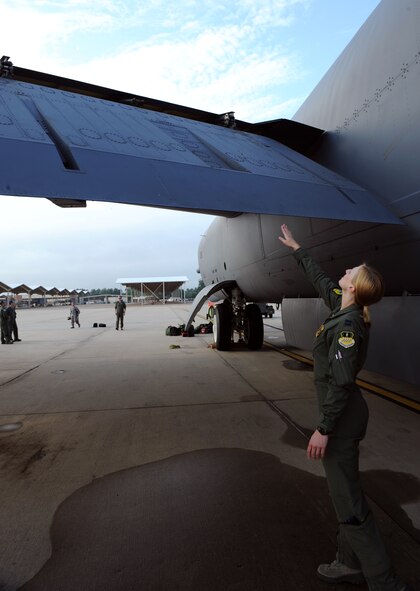 Capt. Christin Mastracchio, 11th Bomb Squadron Formal Training Unit Class 12-02 student, checks the wing flap of a B-52H Stratofortress on Barksdale Air Force Base, La., July 11. Before their flight, the aircrew received a briefing from the crew chiefs about the condition of the aircraft. Then the aircrew inspected their aircraft with an instructor present, giving them guidance on what to look for. (U.S. Air Force photo/Airman 1st Class Benjamin Gonsier)(RELEASED)