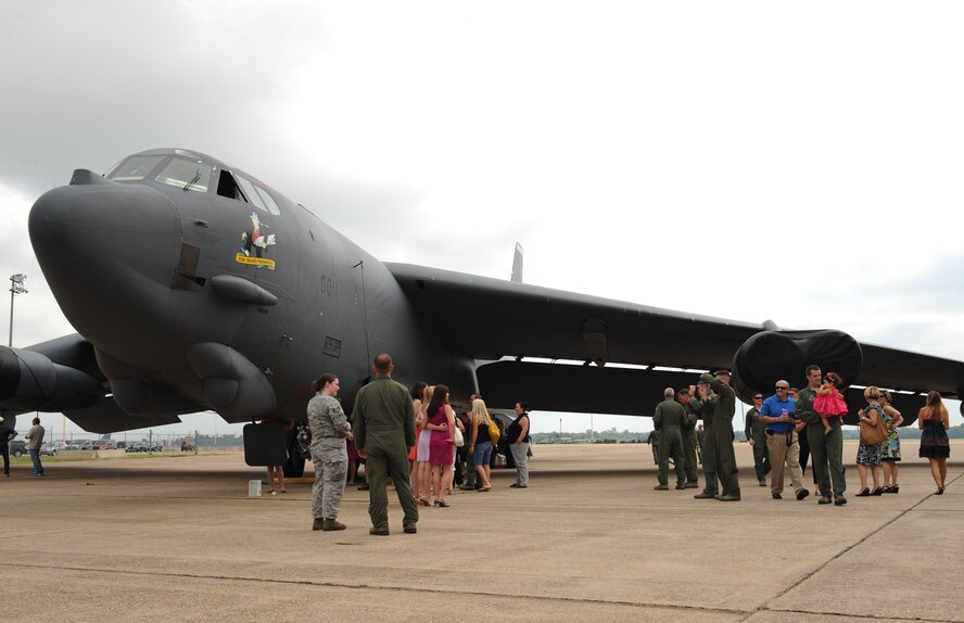 Graduates and their family members along with instructors and students from the 11th Bomb Squadron Formal Training Unit tour a static B-52H Stratofortress after the graduation ceremony for FTU Class 12-01 on Barksdale Air Force Base, La., Jul 10. FTU is a nine month course for pilots, navigators and electronic warfare officers out of their initial flight training. The course consists of academic studies, simulators and flight training where the students gain the experience and confidence to operate a B-52. (U.S. Air Force photo/Airman 1st Class Benjamin Gonsier)(RELEASED)