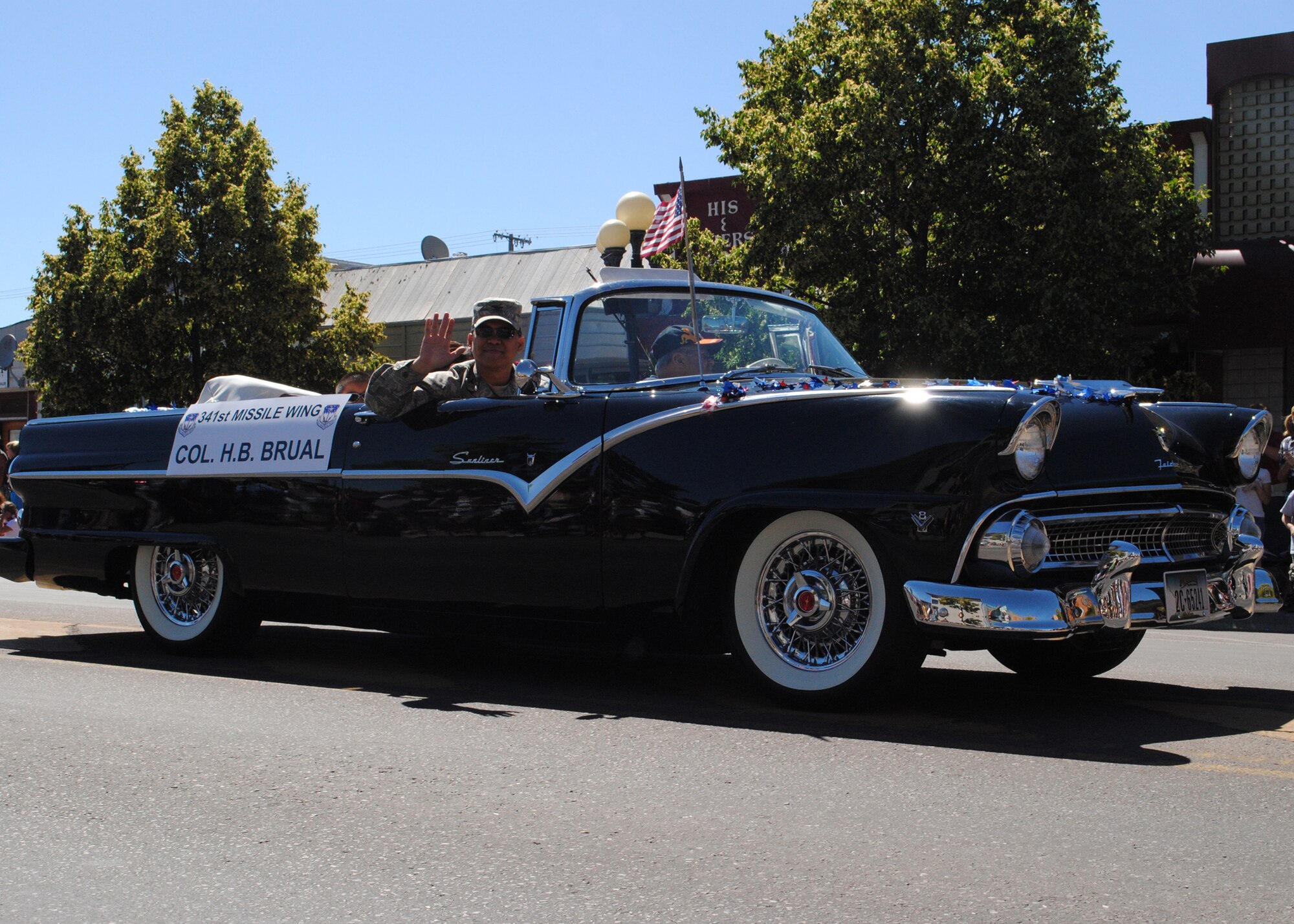 Col. H.B. Brual, 341st Missile Wing commander, waves to the audience at the Fourth of July parade held in downtown Great Falls.  Brual, along with many other members of Team Malmstrom, participated in the parade honoring America’s Independence Day.  (U.S. Air Force photo/Airman 1st Class Cortney Paxton)
