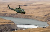 A 40th Helicopter Squadron flight crew flies a UH-1N Huey Iroquois over Montana's landscape.  A four-person crew recently completed the squadron’s 394th save.  (U.S. Air Force photo/Beau Wade)