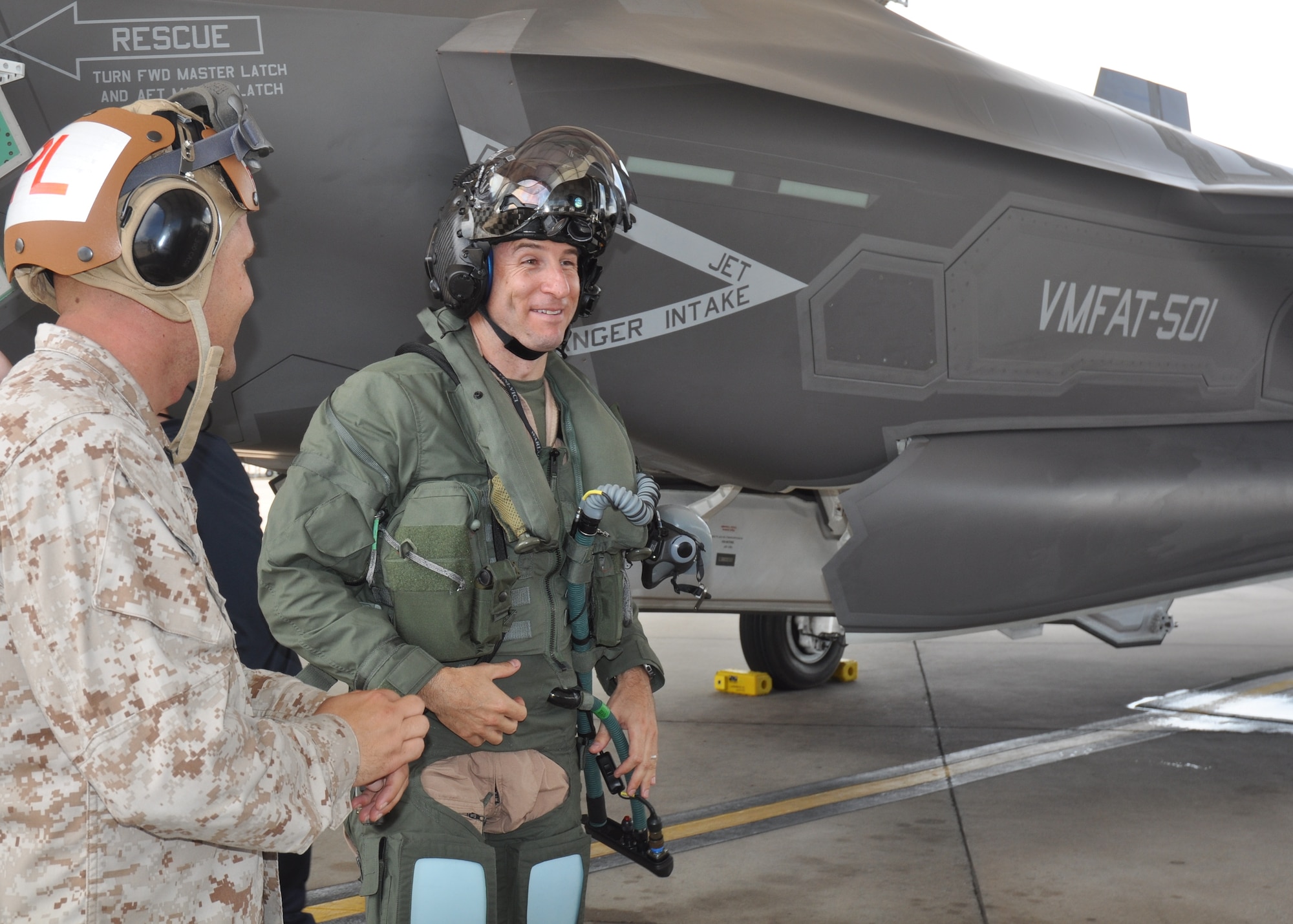 Marine Lt. Col. David Berke, commanding officer for the Marine Fighter Attack Training Squadron 501 is all smiles after he flew the 100th F-35 Lightning II sortie at the 33rd Fighter Wing, Eglin AFB, Fla. July 11. The 33rd FW’s 100 flights completed include 74 F-35A sorties and 26 F-35B sorties. Current flying operations at the wing consist of Marine and Air Force fighter pilots checking out in the F-35 variants for each service.  (U.S. Air Force photo/Maj. Karen Roganov)