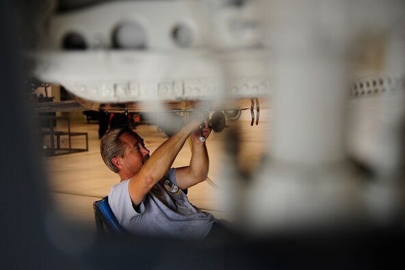 WHITEMAN AIR FORCE BASE, Mo. -- Jim Sollars, M1 Support Services contractor, closes an airframe gear mounted box of a T-38 Talon with safety wire after replacing the oil and filter July 3. The maintenance was part of an hourly postflight inspection done to the aircraft every 225 flight hours. (U.S. Air Force photo/ Senior Airman Cody H. Ramirez)



 







