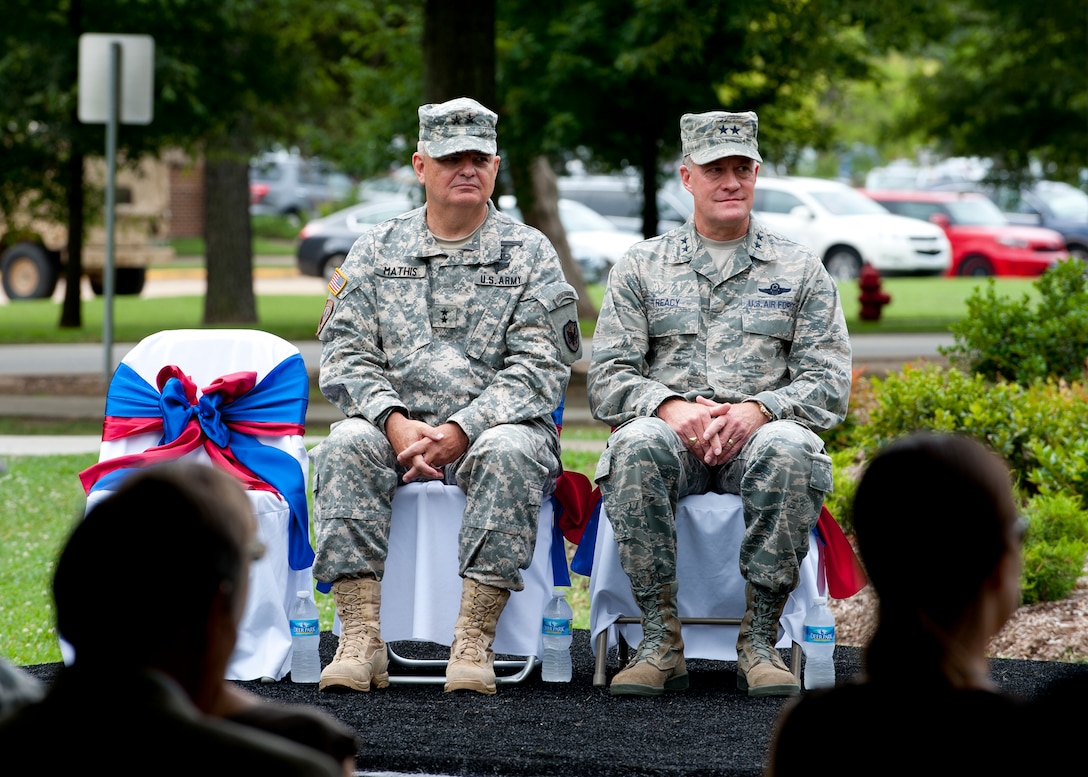 Maj. Gen. Jeff Mathis, Joint Task Force Civil Support commander, and Maj. Gen. Jonathan Treacy, former JTF-CS commander sit and listen to remarks made by Lt. Gen. William Caldwell IV, U.S. Army North commander during the JTF-CS change of command, at Seay Plaza, Fort Eustis, Va., July 11, 2012. JTF-CS is the nations' only standing chemical, biological, radiological and nuclear joint task force. It is comprised of active-duty and reserve component Service members from the U.S. Army, Navy, Air Force and Marines. (U.S. Air Force photo by Senior Airman John D. Strong II/Released)