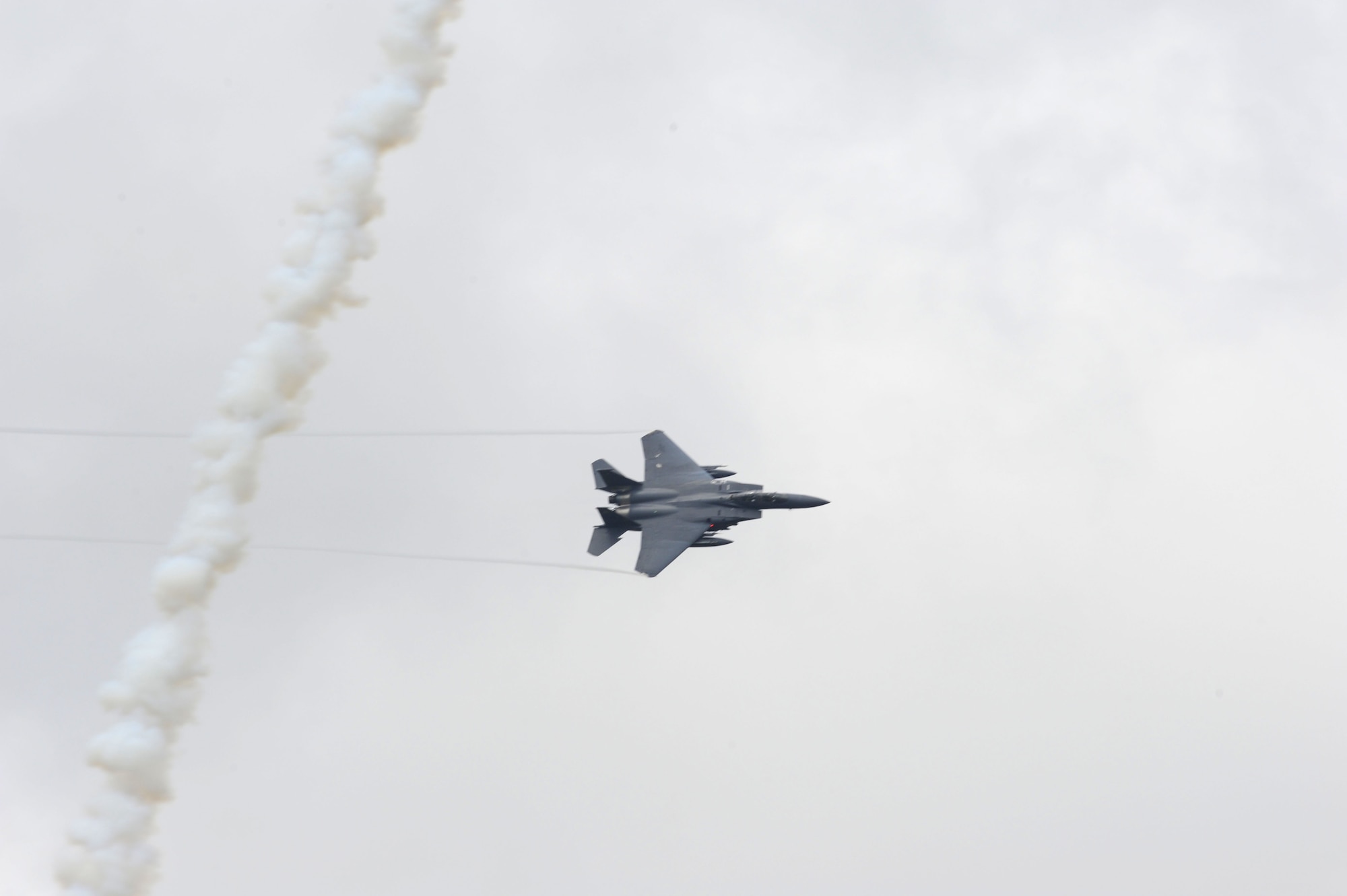 An F-15E Strike Eagle from the 333rd Fighter Squadron banks right to avoid a simulated surface-to-air missile during a training mission at the Dare County Bomb Range, N.C., July 11, 2012. The range allows F-15E aircrew the ability to hone their close air support skills. (U.S. Air Force photo/Senior Airman Gino Reyes/Released) 