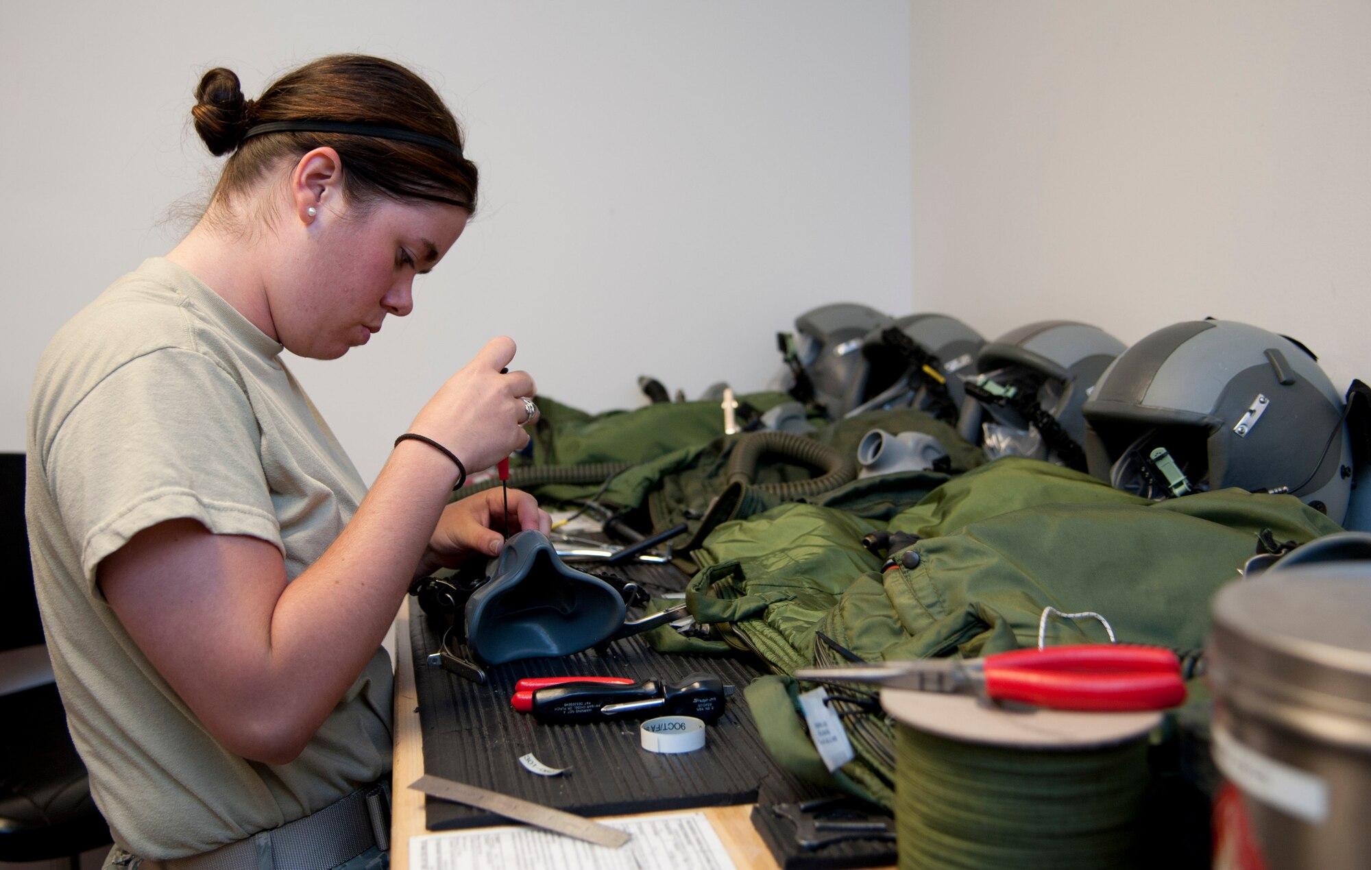 Airman 1st Class Lindsy Hall, 6th Air Refueling Squadron aircrew flight equipment journeyman, puts together a mask for a C-17 Globemaster III pilot Tuesday. AFE personnel are in charge of ensuring all flight equipment is in perfect working order, from flight helmets to oxygen masks. (U.S. Air Force photo/Airman 1st Class Nicole Leidholm)