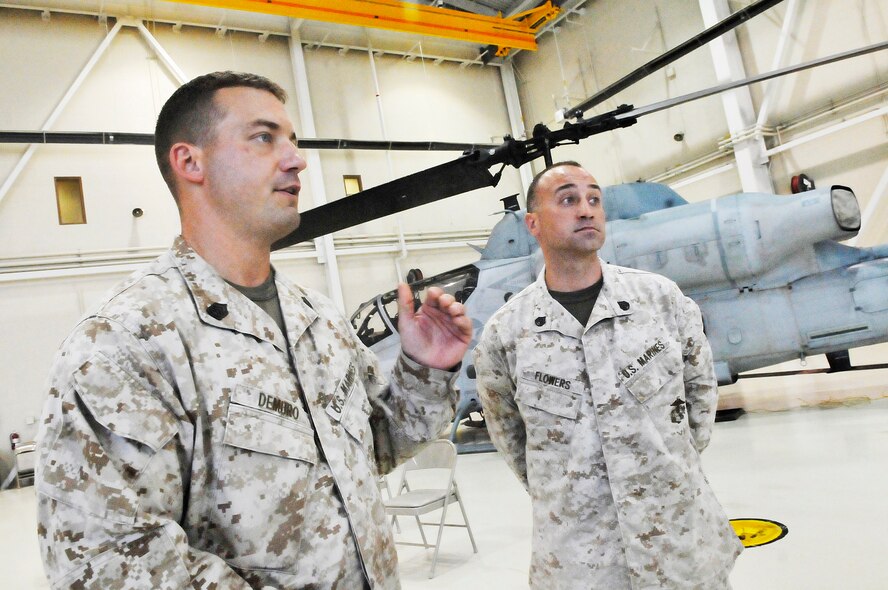 Gunnery Sgt. Dan Demero and Staff Sgt. Corey Flowers talk about the night of fire. Travis Romig also assisted in the evacuations at Sandpiper Apartments in Warner Robins. (U. S. Air Force photo/Sue Sapp)