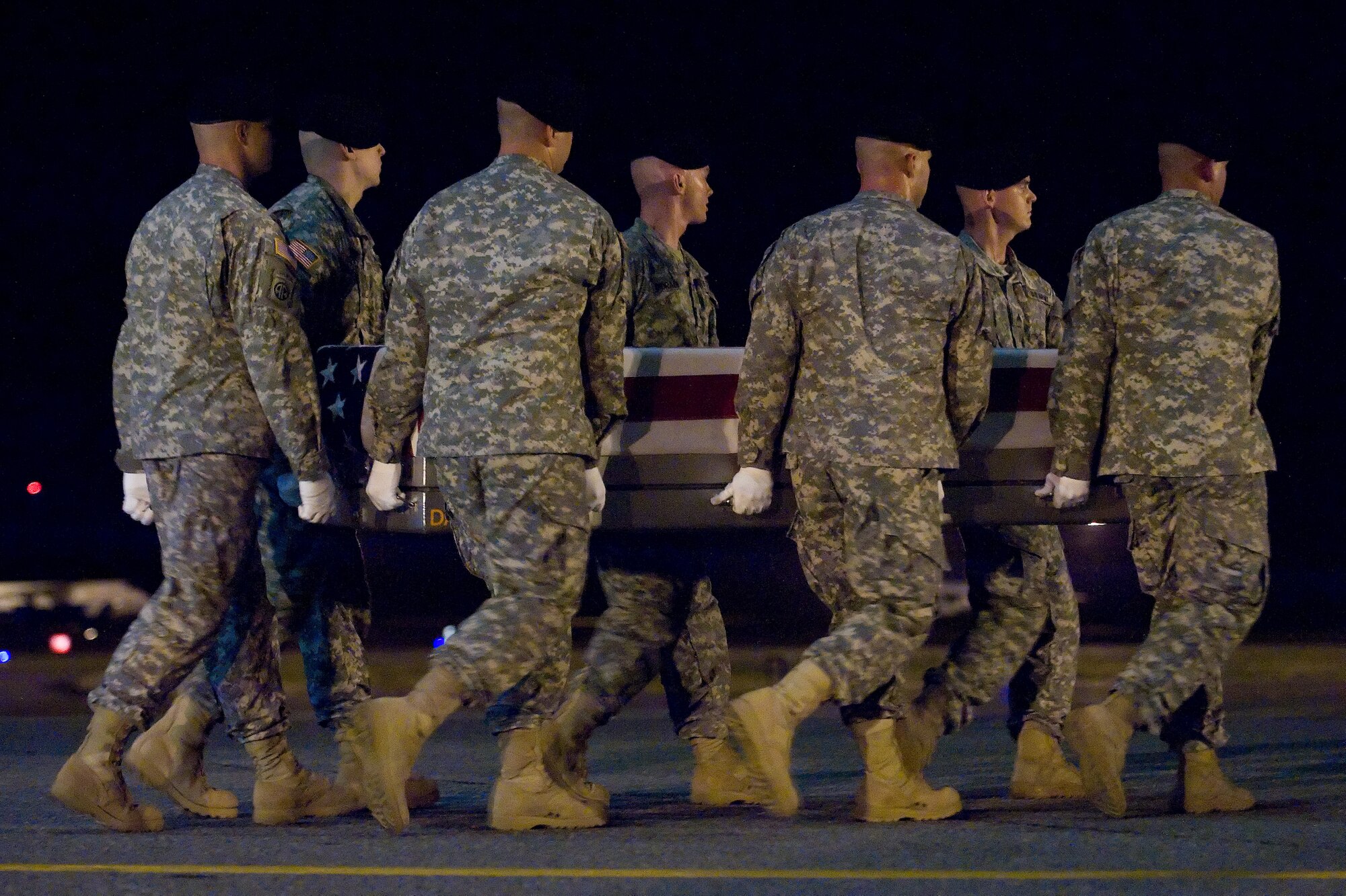A U.S. Army carry team transfers the remains of Army Pfc. Alejandro J. Pardo of Porterville, Calif., at Dover Air Force Base, Del., July 12, 2012. Pardo was assigned to the 978th Military Police Company, 93rd Police Battalion, Fort Bliss, Texas. (U.S. Air Force photo/Adrian R. Rowan)