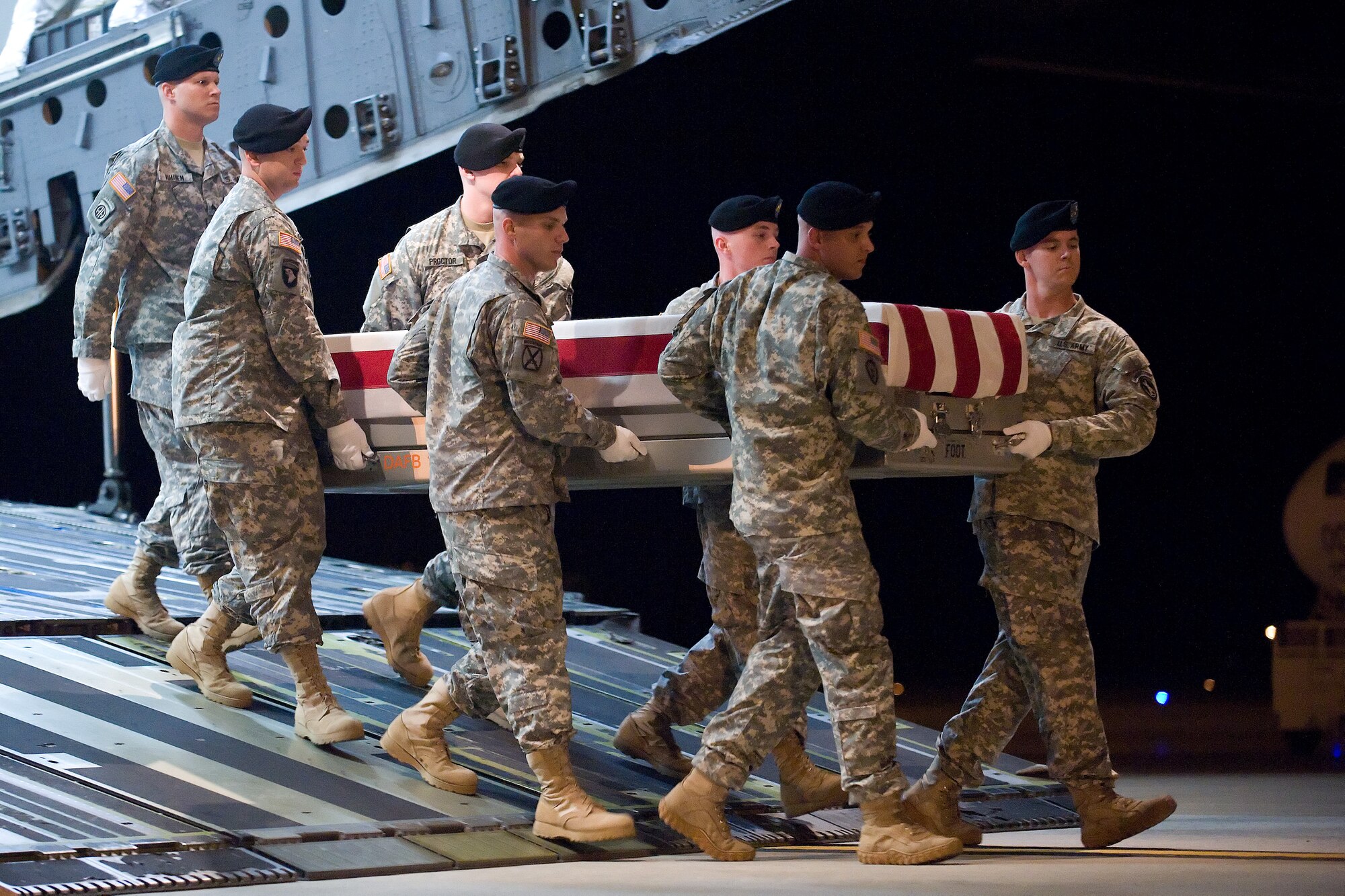 A U.S. Army carry team transfers the remains of Army Pfc. Trevor B. Adkins of Spring Lake, N.C., at Dover Air Force Base, Del., July 12, 2012. Adkins was assigned to the 978th Military Police Company, 93rd Police Battalion, Fort Bliss, Texas. (U.S. Air Force photo/Adrian R. Rowan)