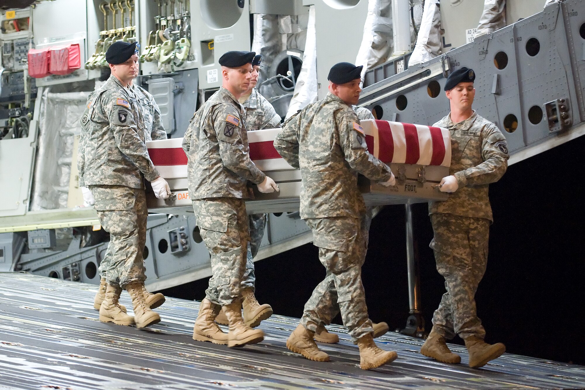 A U.S. Army carry team transfers the remains of Army Spc. Clarence Williams III of Brooksville, Fla., at Dover Air Force Base, Del., July 12, 2012. Williams was assigned to the 978th Military Police Company, 93rd Police Battalion, Fort Bliss, Texas. (U.S. Air Force photo/Adrian R. Rowan)