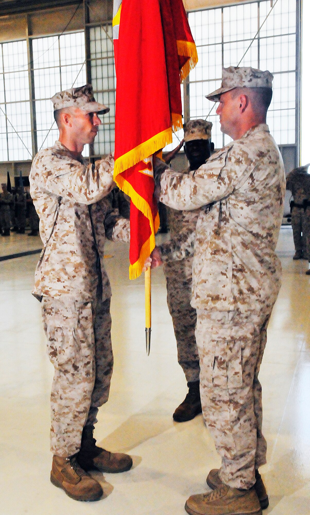 Lt. Col. David M. Steele, at left, assumes command of Marine Aircraft Group 49, Det. A, from Lt. Col. Michael H. Johnson during a change of command ceremony Monday. (U. S. Air force photo/Sue Sapp)