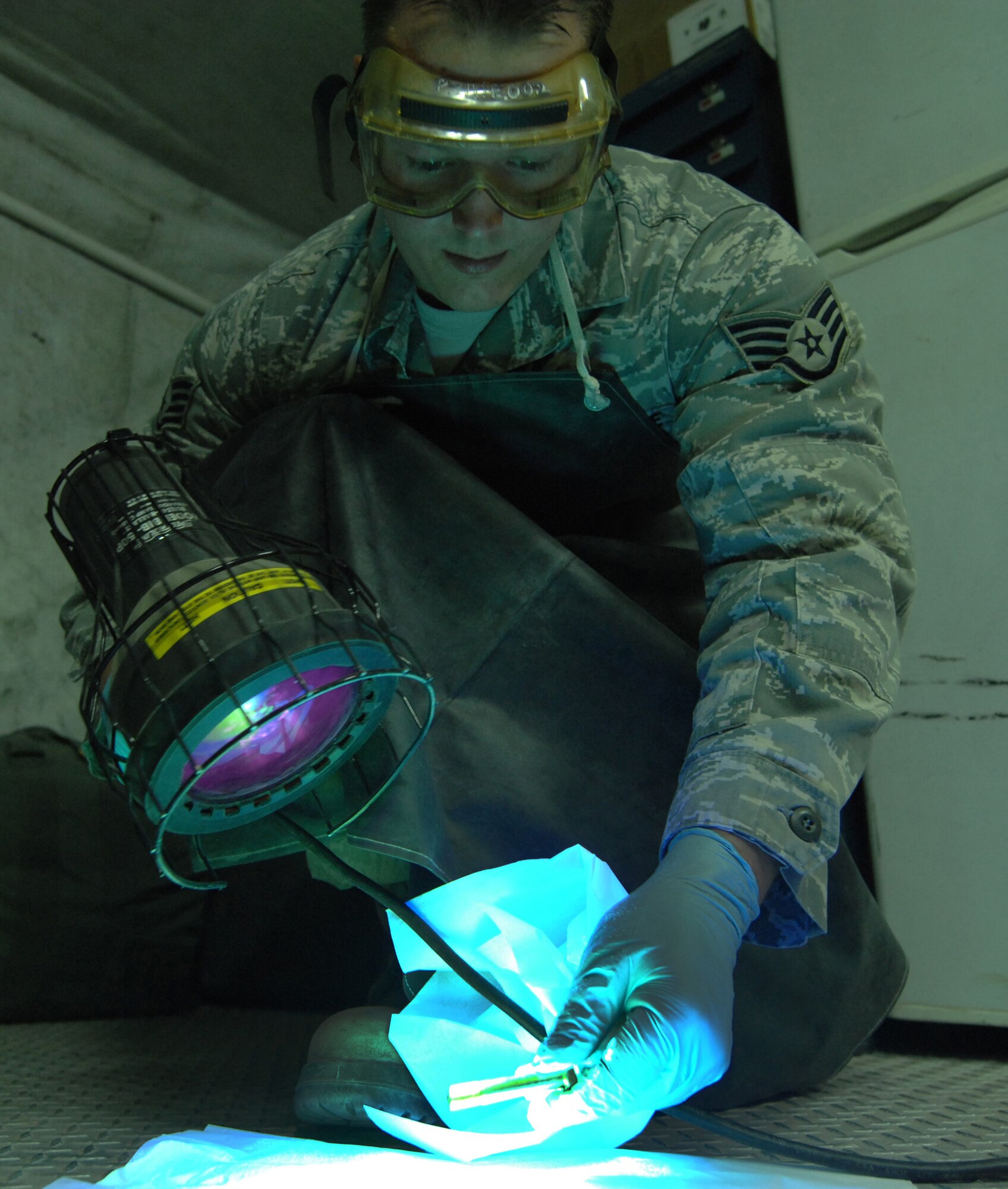 Staff Sgt. Michael Williams performs a nondestructive inspection of equipment at an undisclosed location in Southwest Asia on July 10, 2012. During the inspection, Williams looked for structural fatigue to avert catastrophic failure of components. Williams is with the 386th Expeditionary Maintenance Squadron. (U.S. Air Force photo/Staff Sgt. Alexandra M. Boutte)