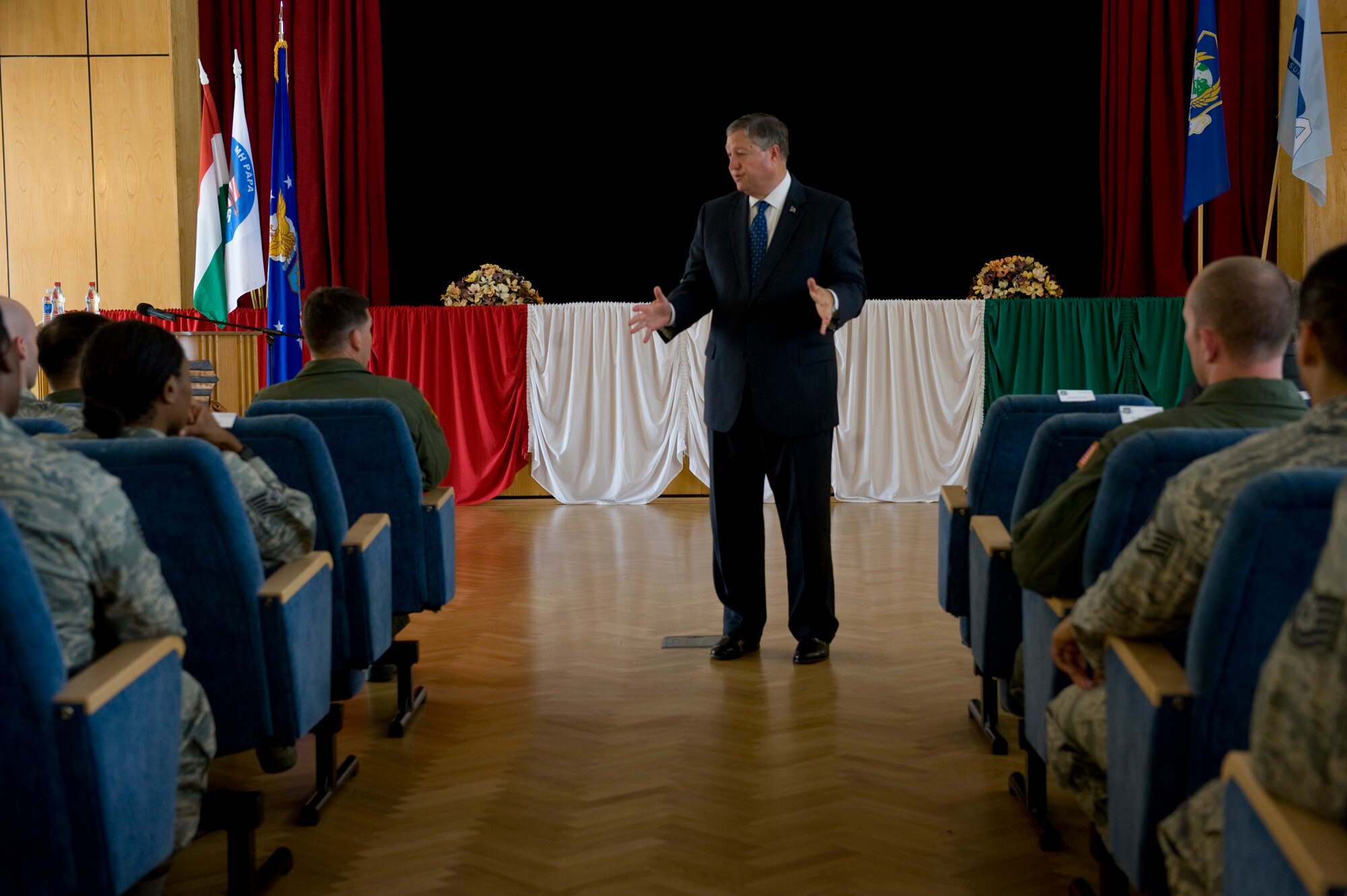 Secretary of the Air Force Michael Donley addresses Airmen and their spouses during an "all call" at the Cultural Center at Pápa Air Base, Hungary, July 11, 2012. The secretary visited the Heavy Airlift Wing to speak with Airmen about the direction of the Air Force, meet with them on the job and learn what's on their minds. (U.S. Air Force photo/Master Sgt. Wayne Clark)