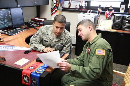 Master Sgt. Don Pedro, 2nd and 32nd Air Refueling Squadrons first sergeant, discuss manning issues with Master Sgt. Luis Rodriguez-Asad, 2nd ARS boom operator. This special-duty position affords senior NCOs the ability to help their Airmen by applying their personal experience and years of service. (U.S. Air Force courtesy photo/Released)
