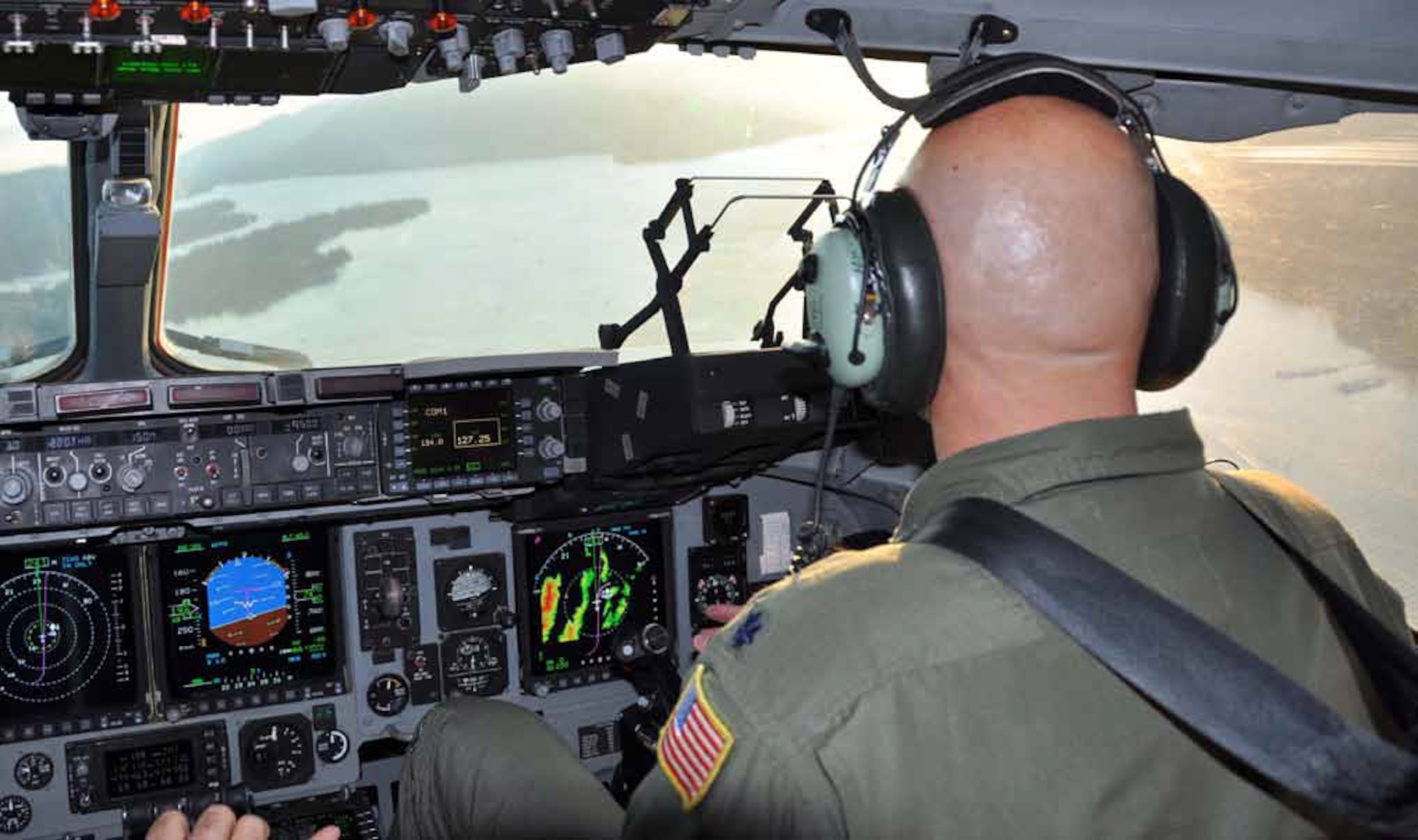 Lt. Col. Tim Harris, pilot, 729th Airlift Squadron, is pictured as he pilots the massive C-17 Globemaster III, over Big Bear during the aircraft’s 16 flyovers performed in support of Fourth of July celebrations held throughout Southern California, July 4.   (U.S. Air Force photo by Staff Sgt. Megan Crusher)