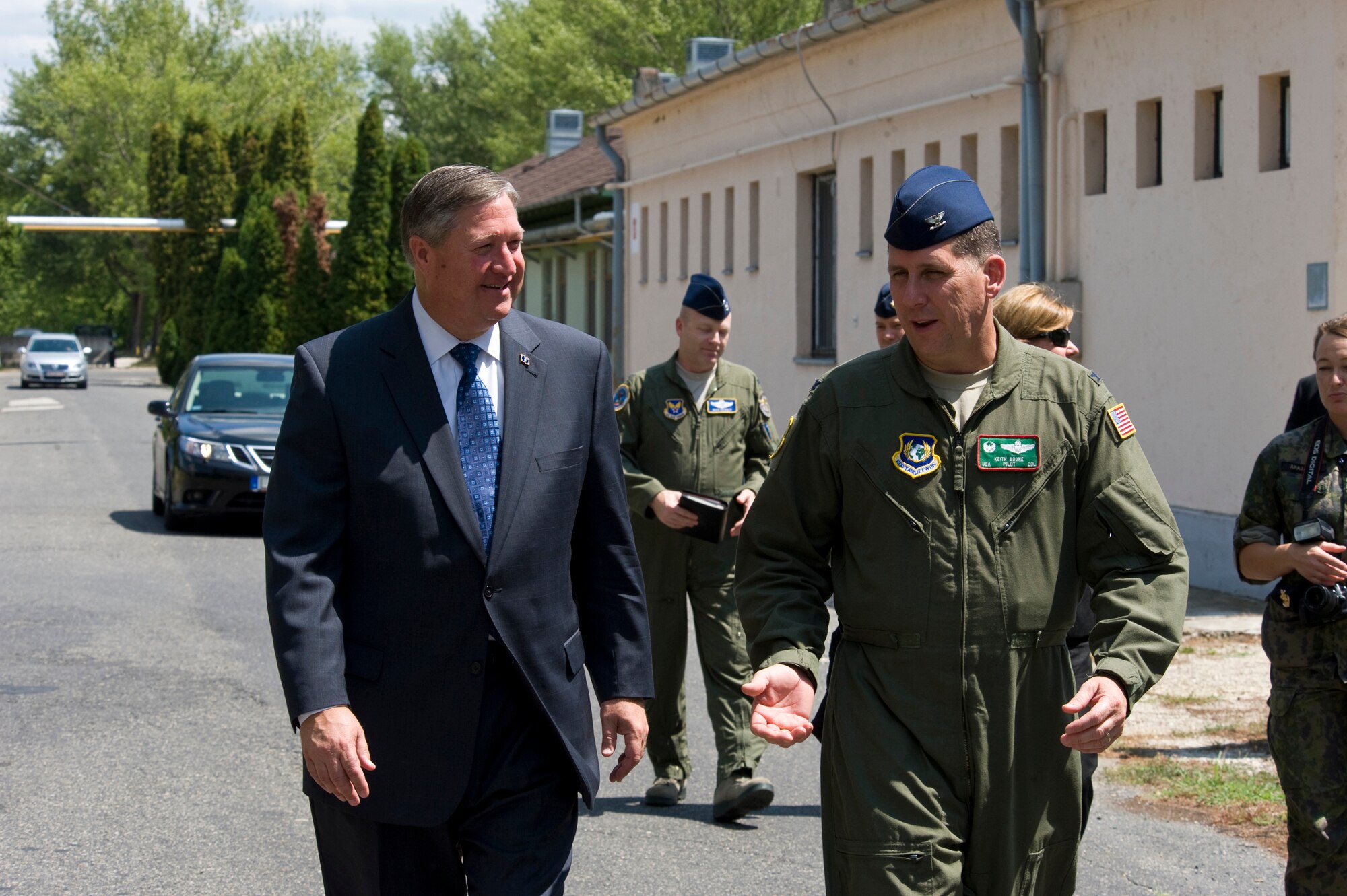 Col. Keith Boone, commander of the Heavy Airlift Wing, talks with Secretary of the Air Force Michael Donley during a tour of Pápa Air Base, Hungary, July 11, 2012. The secretary visited the HAW to speak with Airmen about the direction of the Air Force, meet with them on the job and learn what's on their minds. (U.S. Air Force photo/Master Sgt. Wayne Clark)