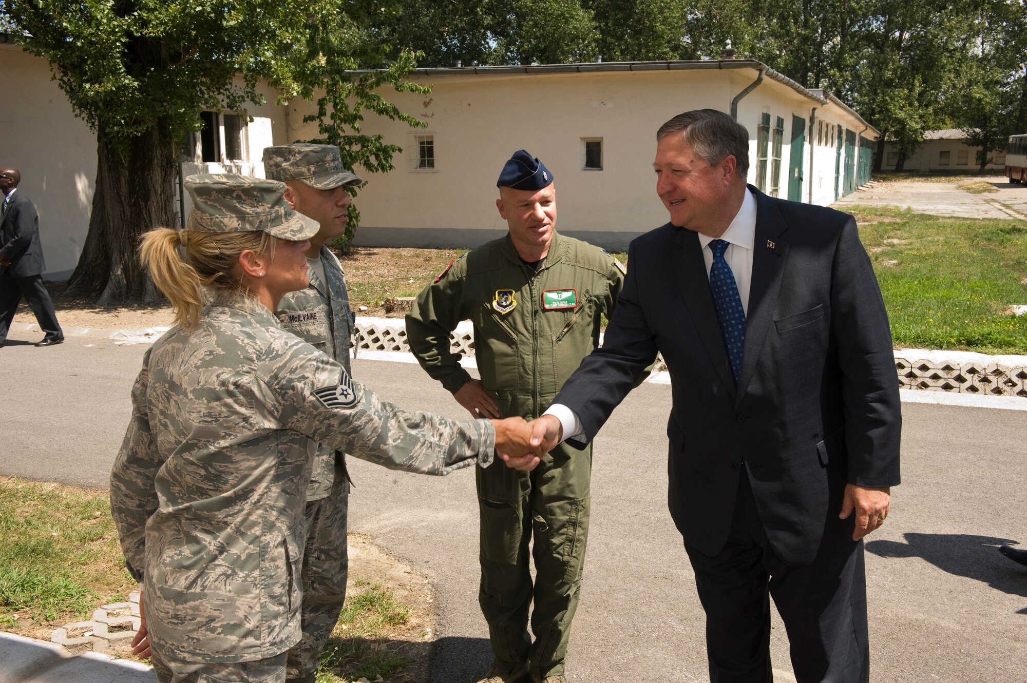 Secretary of the Air Force Michael Donley meets Staff Sgt. Theiesa Morgan and Tech. Sgt. Jason McIlvaine, both independent duty medical technicians, and Lt. Col. Pete Sipos, HAW Medical Director, during a tour of Pápa Air Base, Hungary, July 11, 2012. The secretary visited the HAW to speak with Airmen about the direction of the Air Force, meet with them on the job and learn what's on their minds. (U.S. Air Force photo/Master Sgt. Wayne Clark)