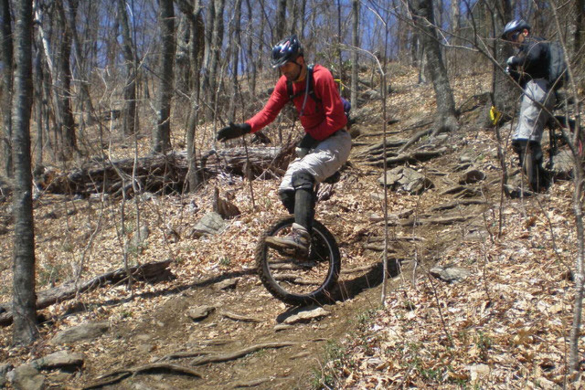 Ben Richardson rides downhill on his mountain unicycle.  He teaches unicycling lessons on JBER. (Courtesy photo)