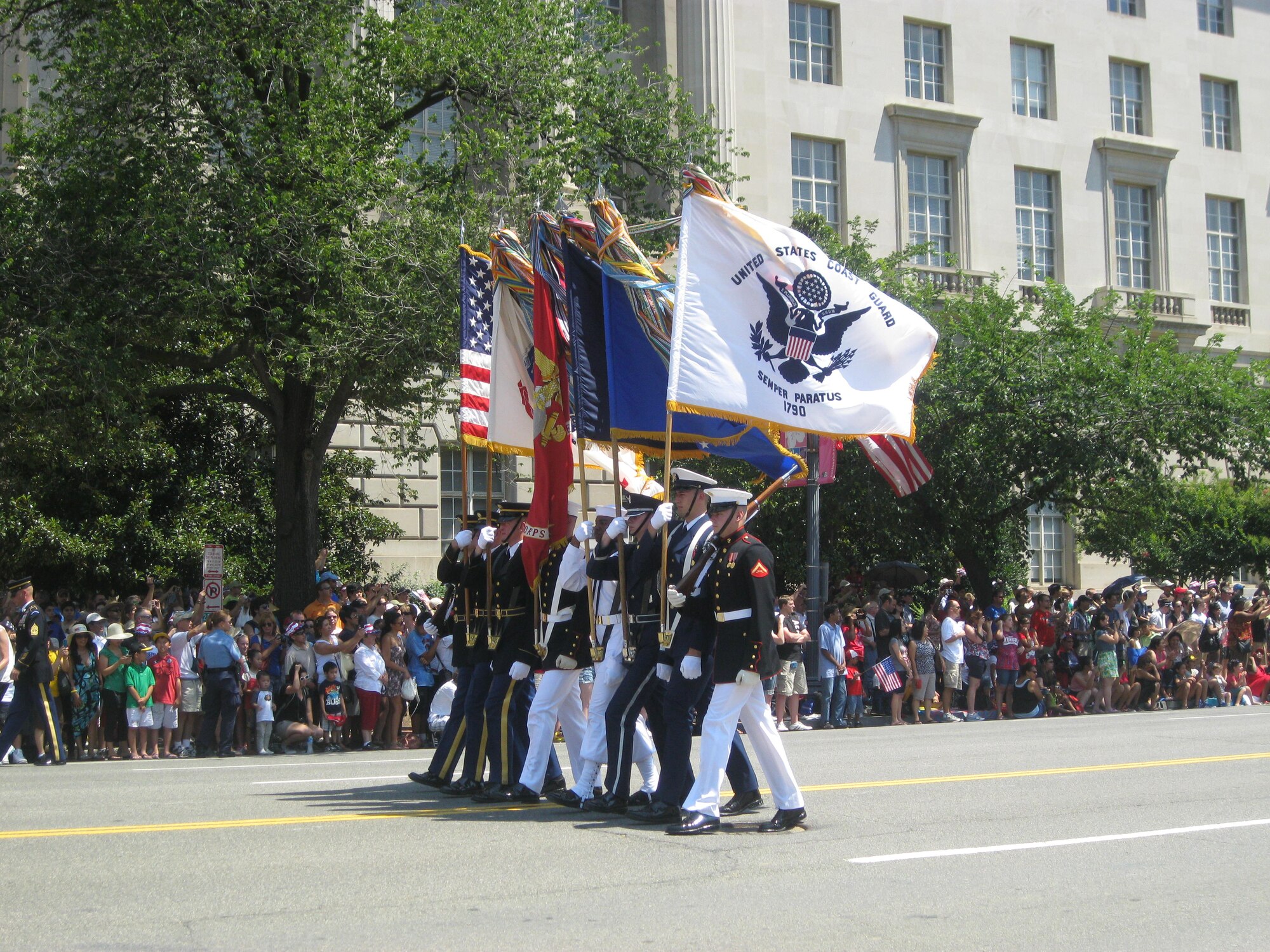 Service members from each branch of military-service march with their respective flags during the Independence Day Parade in Washington, D.C., July 4, 2012. More than 20 members of Team Seymour were selected to attend the parade and a dinner at the the White House to celebrate the holiday. (U.S. Air Force photo/Staff Sgt. Aimee Inman/Released)