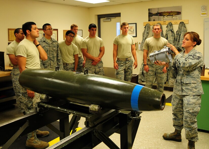 Tech. Sgt. Elise Vankoetsveld, 9th Munitions Squadron instructor, explains implements of bomb building to Air Force Academy cadets at the Air Force Combat Ammunitions School, Beale Air Force Base, Calif., July 11, 2012. The cadets also got the chance to tour different squadrons, visit local attractions and learn more about Beale's mission. (U.S. Air Force photo by Senior Airman Shawn Nickel/Released)