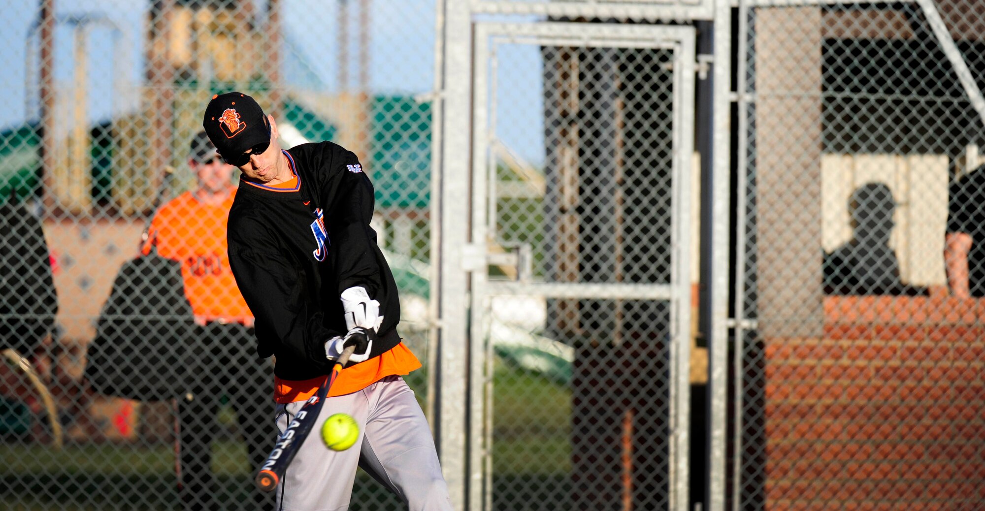 RAF MILDENHALL, England – Gabriel Temples, 100th Logistics Readiness Squadron, takes a crack at the ball during an intramural softball game July 11, 2012, at RAF Mildenhall. The 100th LRS team beat the 488th Intelligence Squadron 13-6. (U.S. Air Force photo/Senior Airman Ethan Morgan)    