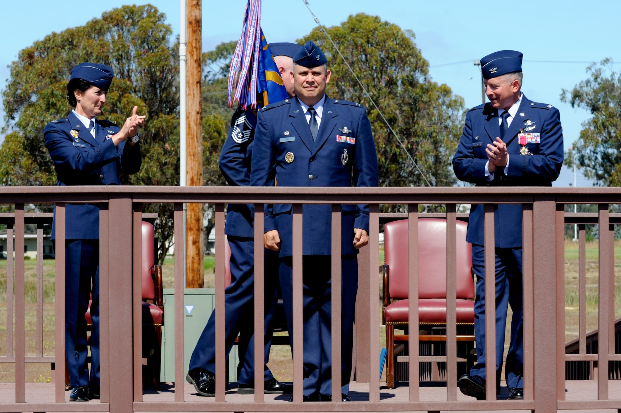 VANDENBERG AIR FORCE BASE, Calif. --  Col. Nina Armagno, the 30th Space Wing commander, and Col. Kelly Kirts, the departing 30th Mission Supprt Group commander, applaud after Col. Jed Davis, the arriving 30th MSG commander, accepts command of the group at the parade grounds here Tuesday, July 10, 2012. The 30th MSG provides security, law enforcement, disaster response, civil engineer, base services, mission support, morale services, contracting, and logistical support for Vandenberg AFB. (U.S. Air Force photo/Staff Sgt. Levi Riendeau)
