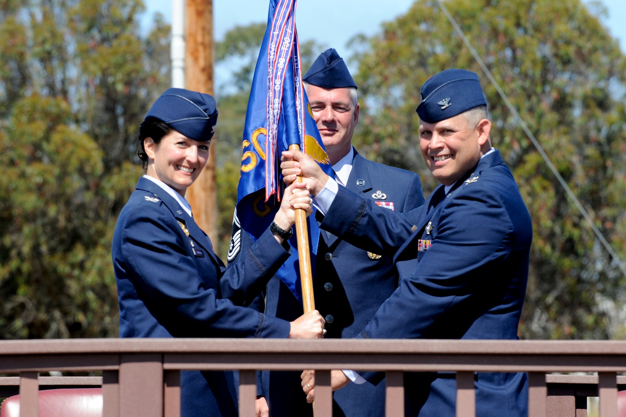 VANDENBERG AIR FORCE BASE, Calif. -- Col. Jed Davis accepts command of the 30th Mission Support Group from Col. Nina Armagno, the 30th Space Wing commander, at the parade grounds here Tuesday, July 10, 2012. The 30th MSG provides security, law enforcement, disaster response, civil engineer, base services, mission support, morale services, contracting, and logistical support for Vandenberg AFB. (U.S. Air Force photo/Staff Sgt. Levi Riendeau)