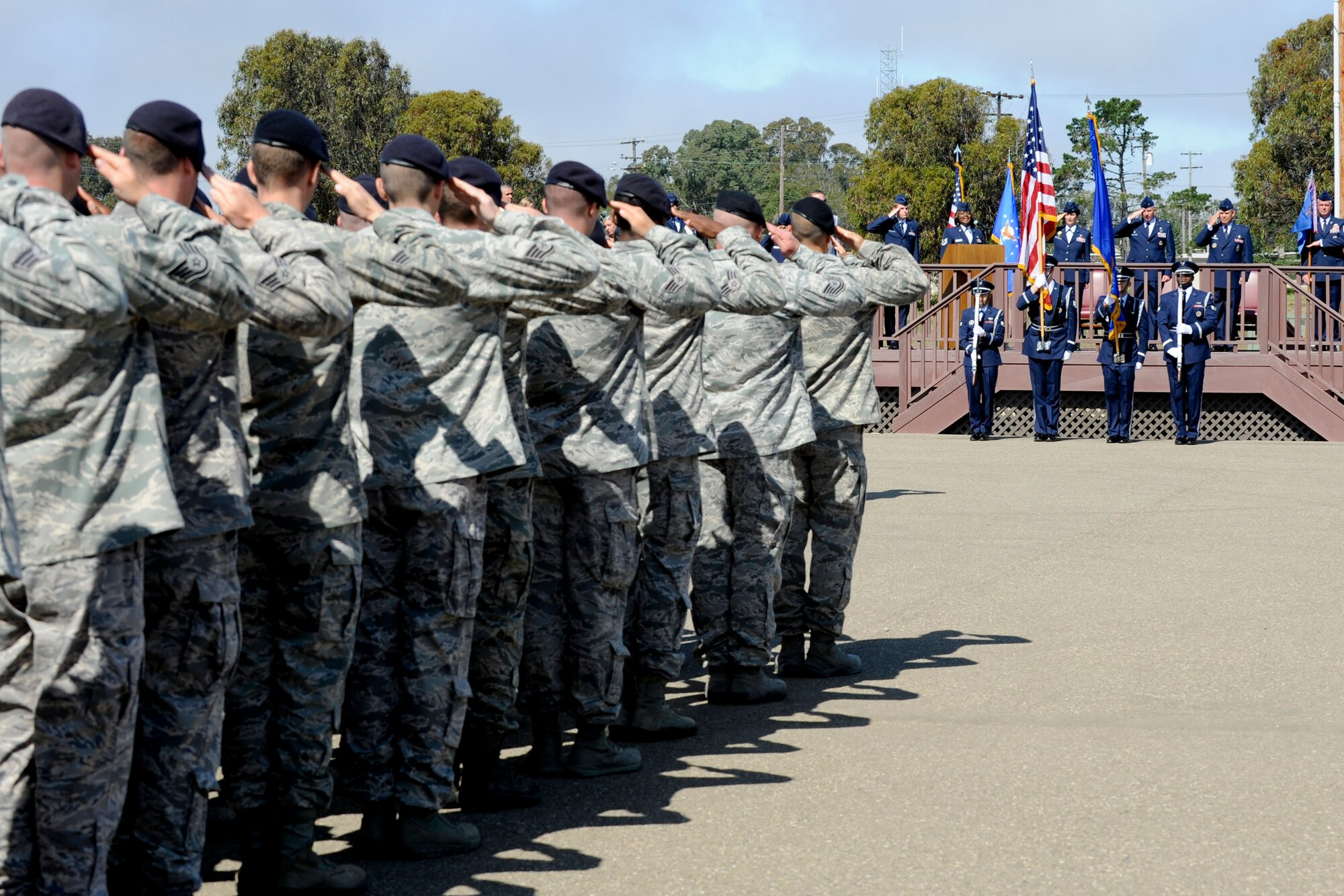 VANDENBERG AIR FORCE BASE, Calif. -- Base leadership salutes during the nation anthem at the parade grounds here Tuesday, July 10, 2012. The 30th Mission Support Group changed commanders, with Col. Nina Armagno, the 30th Space Wing commander, giving command over to Col. Jed Davis. (U.S. Air Force photo/Staff Sgt. Levi Riendeau)