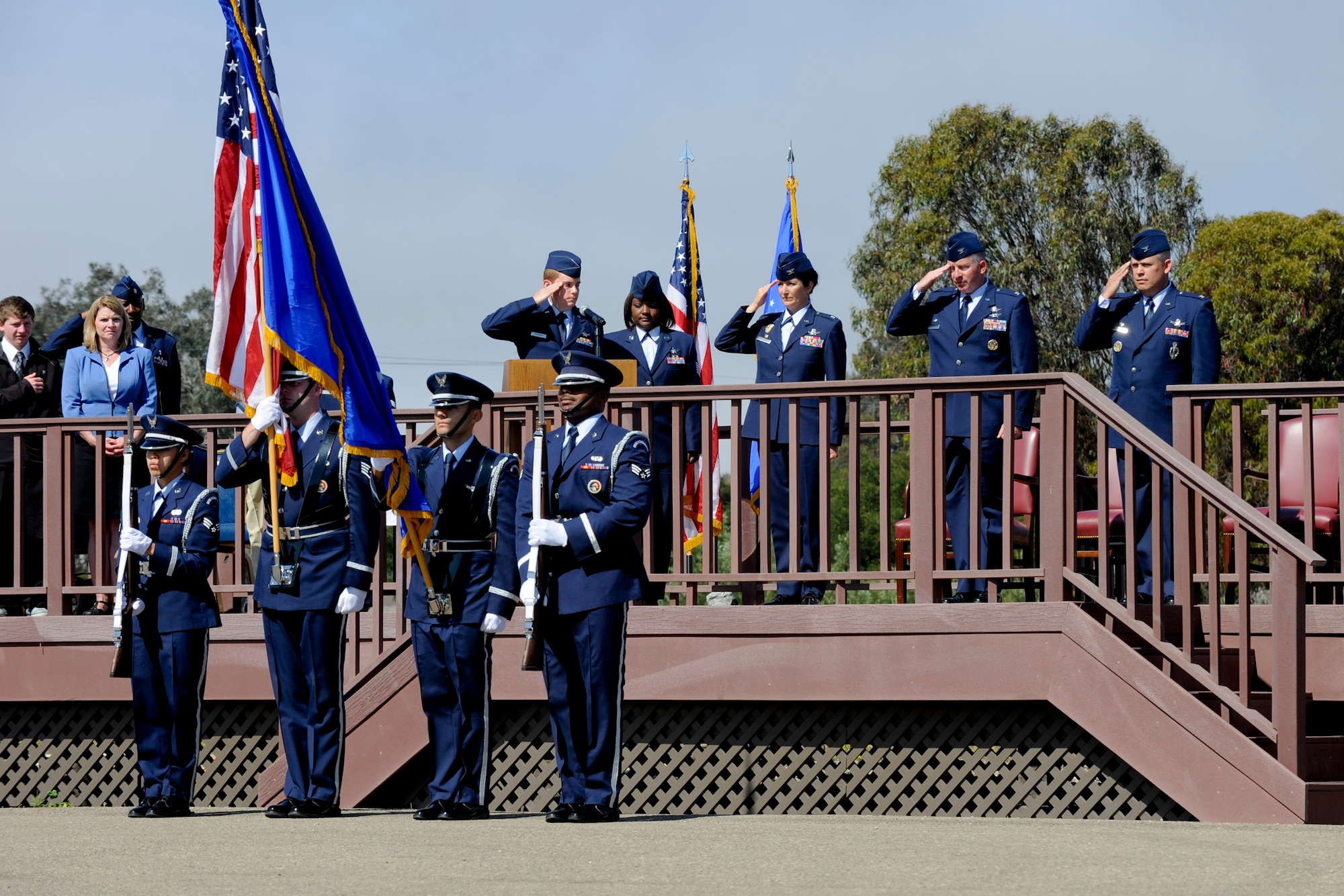 VANDENBERG AIR FORCE BASE, Calif. -- Base leadership salutes during the nation anthem at the parade grounds here Tuesday, July 10, 2012. The 30th Mission Support Group changed commanders, with Col. Nina Armagno, the 30th Space Wing commander, handing command over to Col. Jed Davis. (U.S. Air Force photo/Staff Sgt. Levi Riendeau)