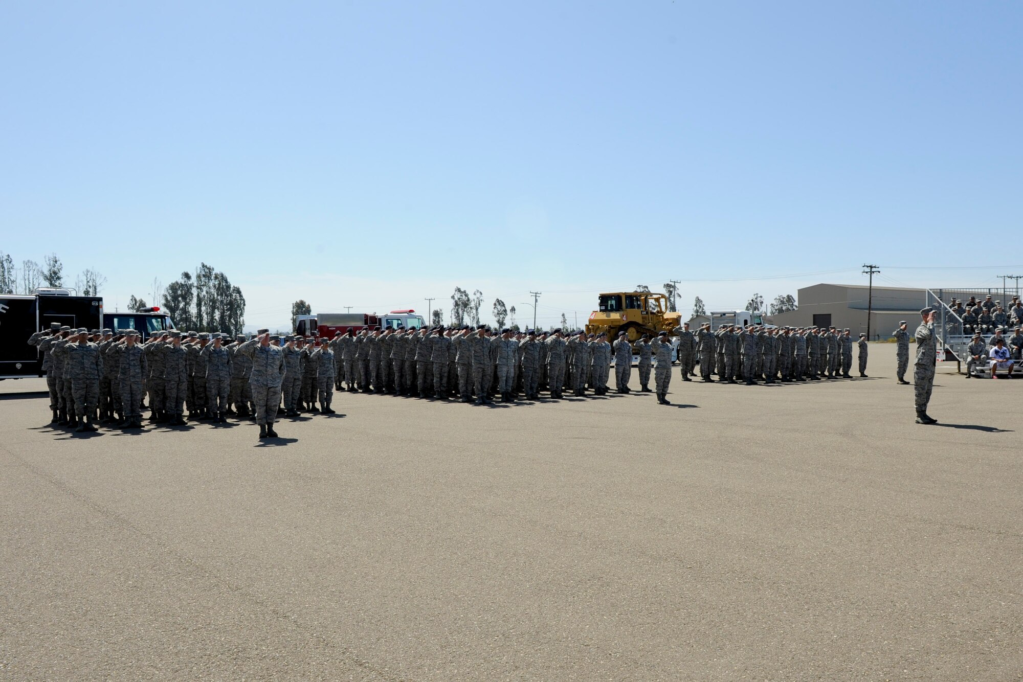 VANDENBERG AIR FORCE BASE, Calif. -- The 30th Mission Support Group salutes during the nation anthem at the parade grounds here Tuesday, July 10, 2012. The 30th MSG changed commands, with Col. Nina Armagno, the 30th Space Wing commander, handing command over to Col. Jed Davis. (U.S. Air Force photo/Staff Sgt. Levi Riendeau)