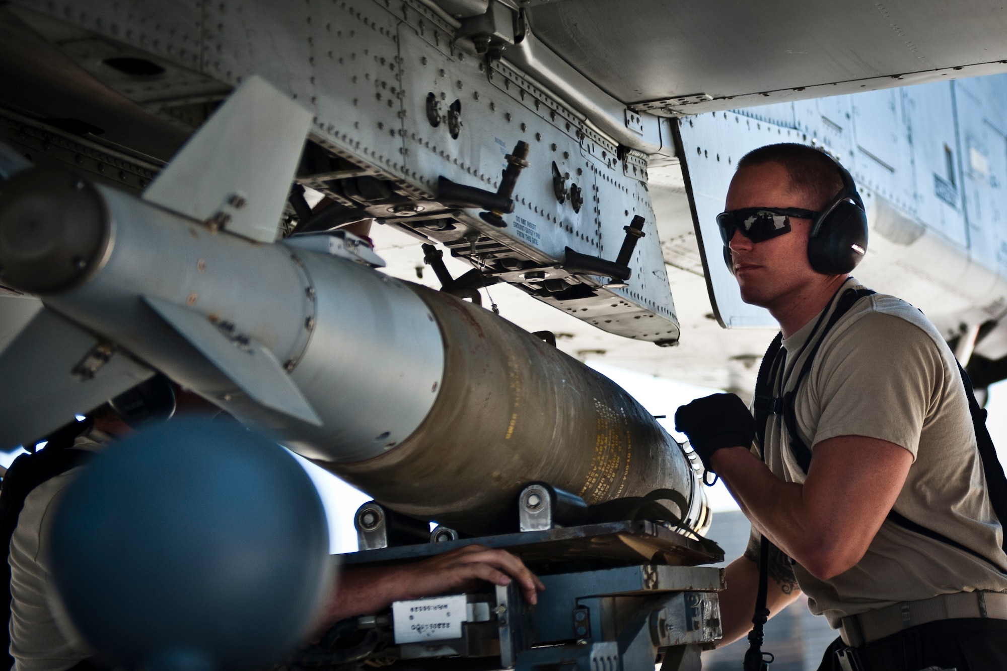 Airmen from the 455th Aircraft Maintenance Squadron, load a GBU-38 smart bomb on to a U.S. Air Force A-10 Thunderbolt II at Bagram Airfield, Afghanistan, June 30, 2012. The bombs were assembled and tested by munitions Airmen with the 455th Maintenance Squadron. (U.S. Air Force photo/Capt. Raymond Geoffroy)