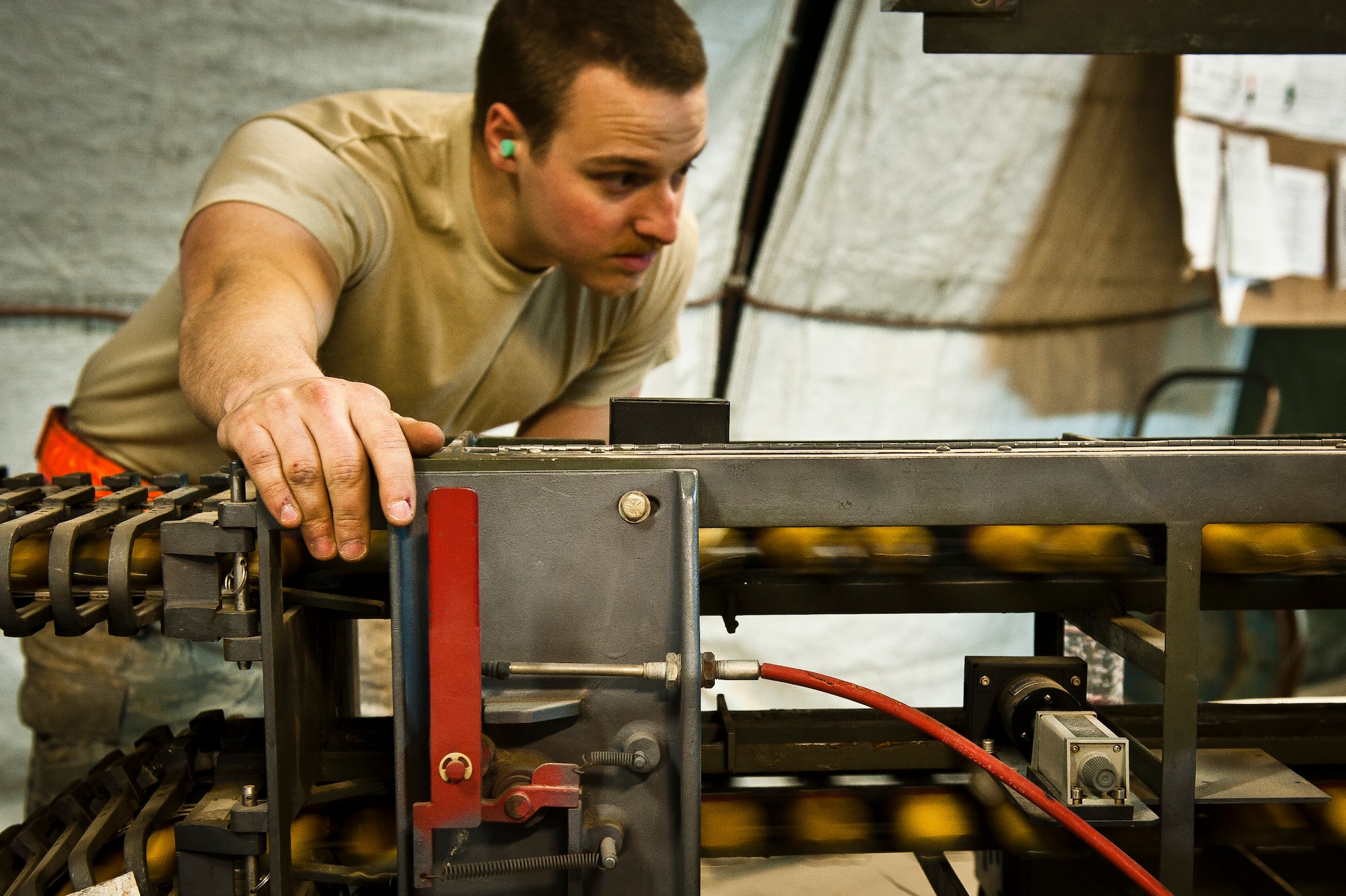 SSgt Joseph Courtney, Munitions Systems Specialist with the 455th Maintenance Squadron, inspects 30mm High Explosive Incendiary rounds into for the U.S. Air Force A-10 Thunderbolt II’s GAU-8/A ‘Avenger’ cannon at Bagram Airfield, Afghanistan, June 29, 2012.455 MXS Munitions Airmen are responsible for processing and inspecting the A-10’s specialized ammunition. (U.S. Air Force photo/Capt. Raymond Geoffroy)
