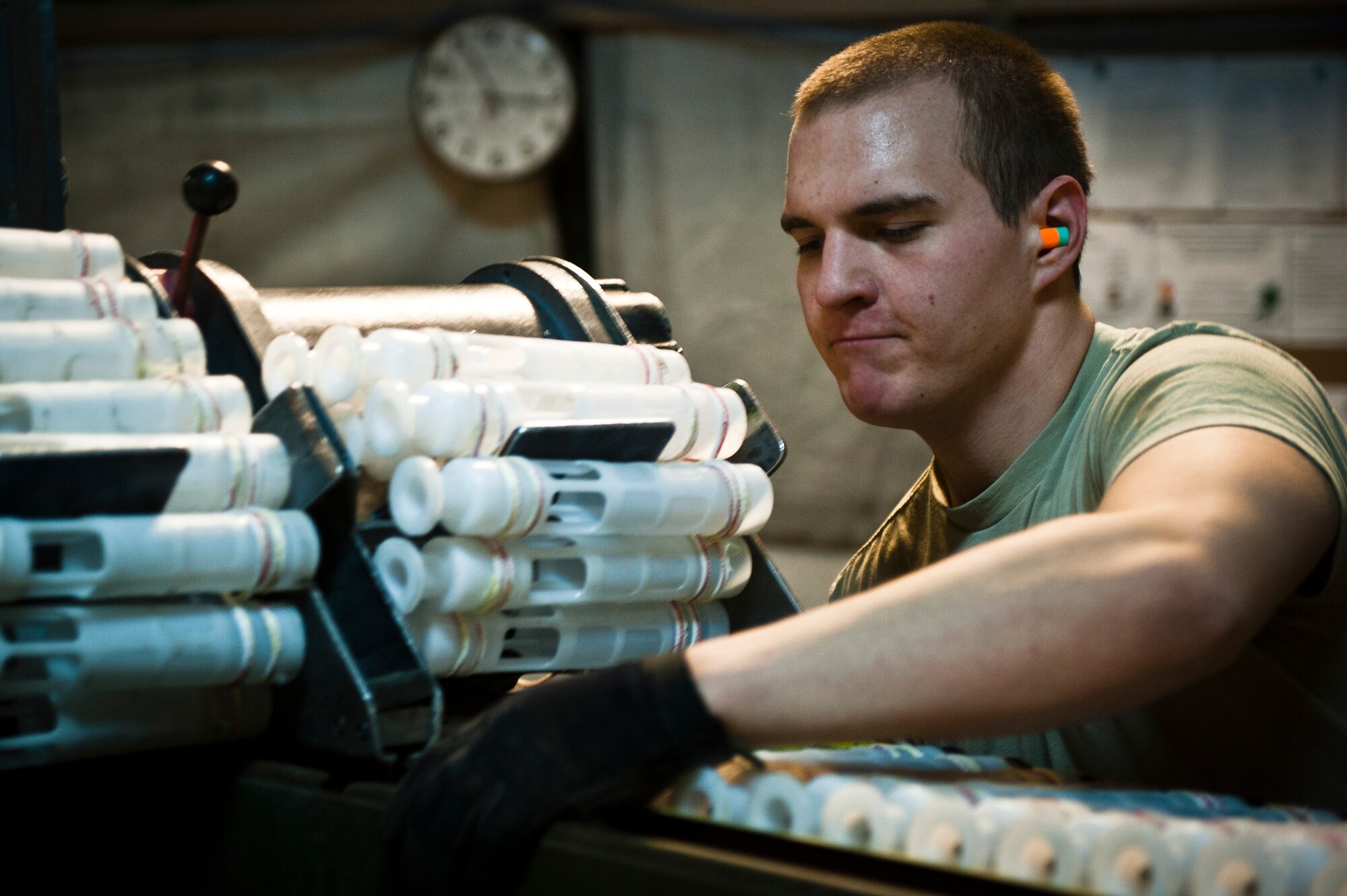 SrA Zane Gorman, Munitions Systems Specialist with the 455th Maintenance Squadron, loads 30mm High Explosive Incendiary rounds into containers to be loaded on U.S. Air Force A-10 Thunderbolt IIs at Bagram Airfield, Afghanistan, June 29, 2012. 455 MXS Munitions Airmen work 24/7 to provide the ammo used by Bagram aircraft to defeat insurgents and protect friendly forces in Afghanistan. (U.S. Air Force photo/Capt. Raymond Geoffroy)