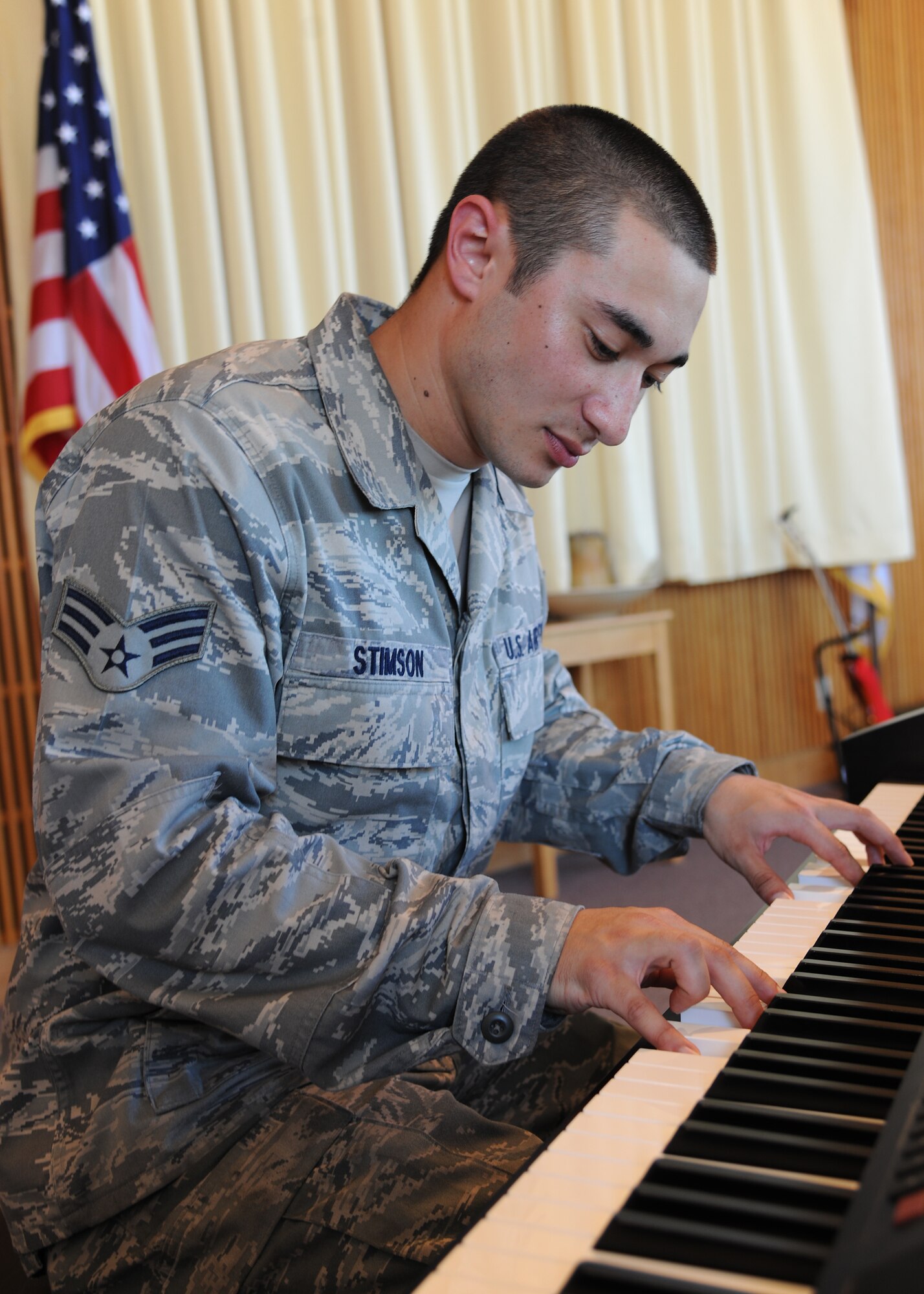 Senior Airman David Stimson, 319th Communications Squadron, practices the piano, on July 11, 2012, at the Prairie Rose Chapel, on Grand Forks Air Force Base, N.D. Stimson was named the latest Warrior of the Week for the 319th Air Base Wing. (U.S. Air Force photo/Airman 1st Class Ashley N. Taylor)  
