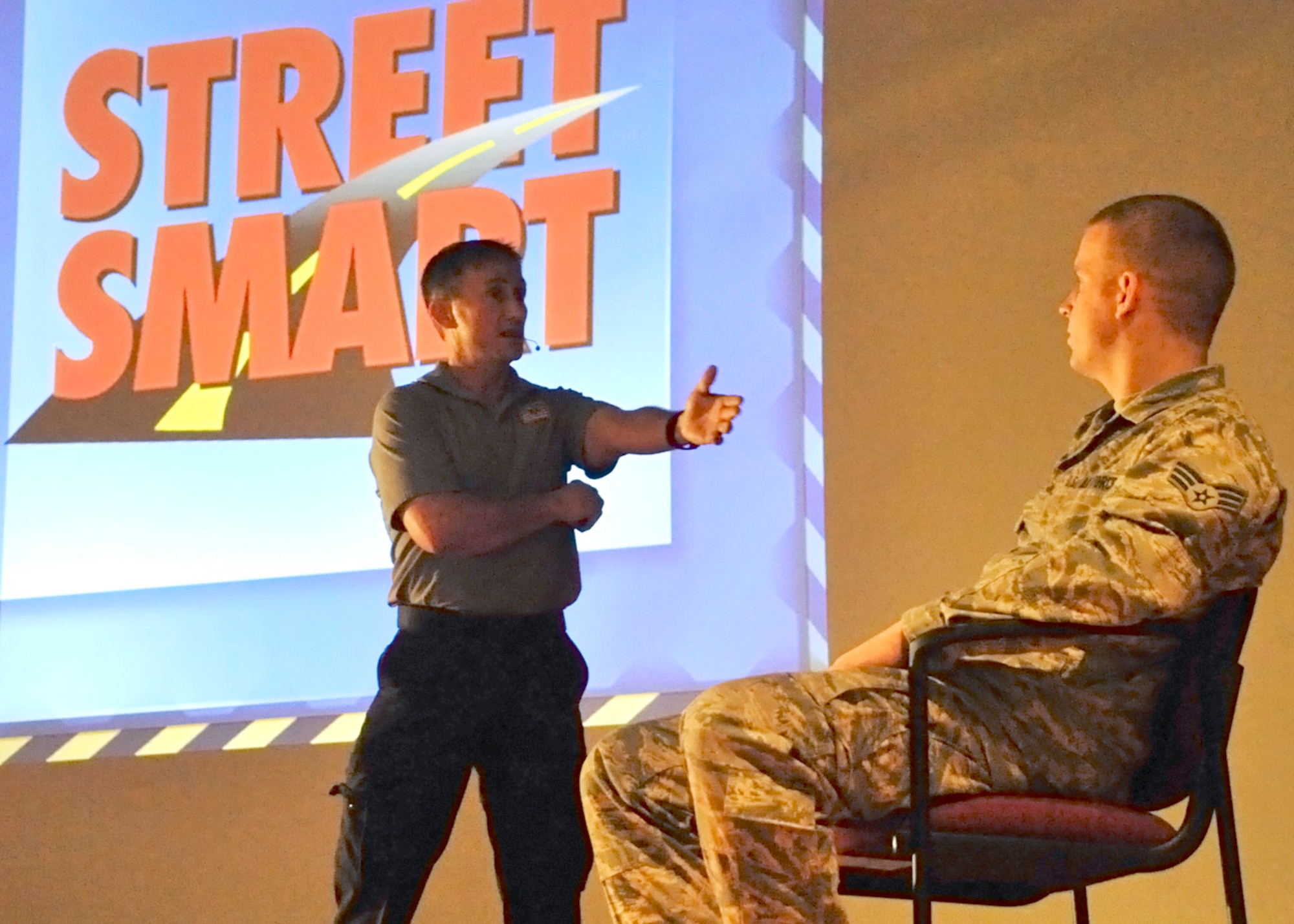 Vince Easevoli, executive director of Florida S.A.F.E. Inc., interacts with Senior Airman Gavin Wendorf during the Street Smart presentation July 11, 2012, at the base theater on Dover Air Force Base, Del. Street Smart is a real-life program that dramatically demonstrates the consequences of poor choices such as alcohol abuse, drug abuse, eating, texting and talking on the telephone while driving, and not wearing a seat belt. (U.S. Air Force photo by Tech. Sgt. Chuck Walker)