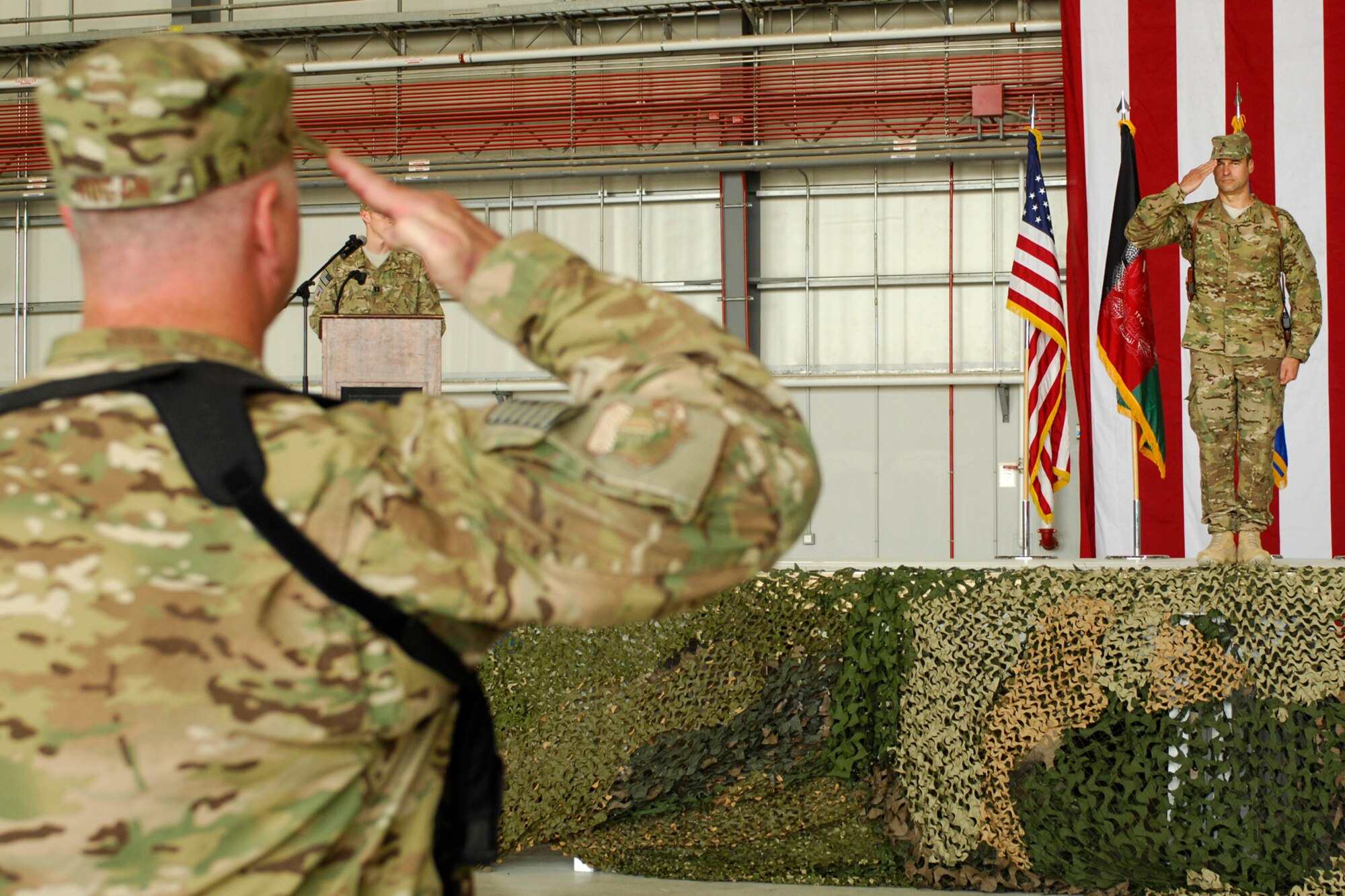 Brig. Gen. Joseph Guastella (right), returns his first salute to Col. Timothy Hogan, 455th Air Expeditionary Wing vice commander, just after he assumed command of the 455 AEW. Guastella is now responsible for approximately 2, 000 Airmen assigned to the wing. (U.S. Air Force photo/Staff Sgt. Jeff Nevison)