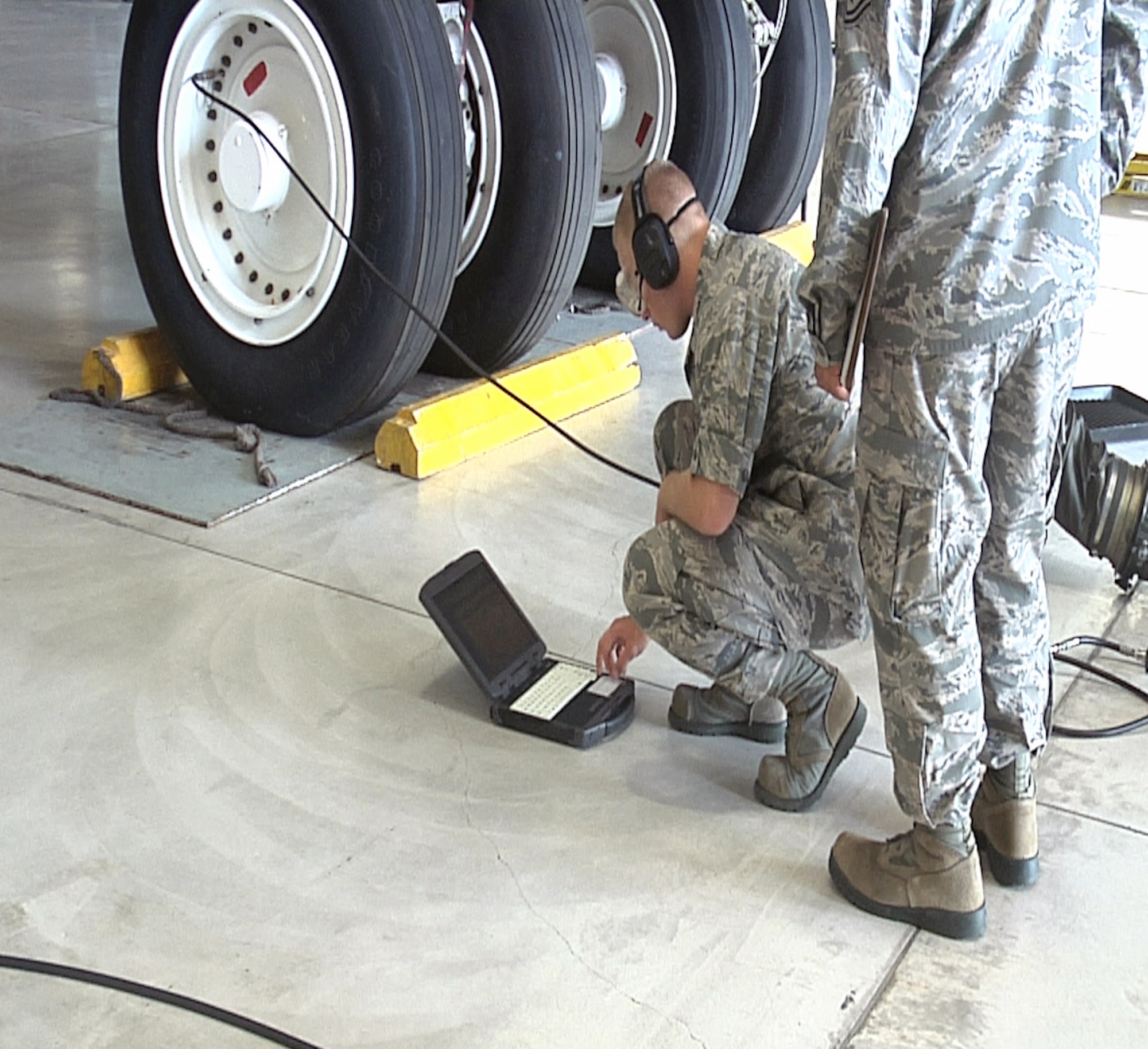 An Airman from the 362nd TRS monitors pressure and settings while doing a maintenance check on the tire of a B-52. The 362nd TRS B-52 Aerospace Maintenance Apprentice course teaches Airmen the fundamentals of becoming a B-52 Crew Chief. (U.S. Air Force Photo/Josh Wilson)