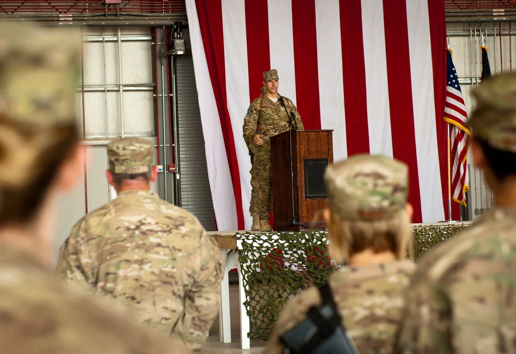 Brig. Gen. Joseph Guastella, 455th Air Expeditionary Wing commander, speaks to assembled 455 AEW Airmen and guests during the wing’s change of command ceremony at Bagram Airfield, Afghanistan, July 12, 2012. Guastella is now responsible for leading the 455 AEW in providing dedicated airpower to coalition forces in Afghanistan. (U.S. Air Force Photo/Capt. Raymond Geoffroy)
