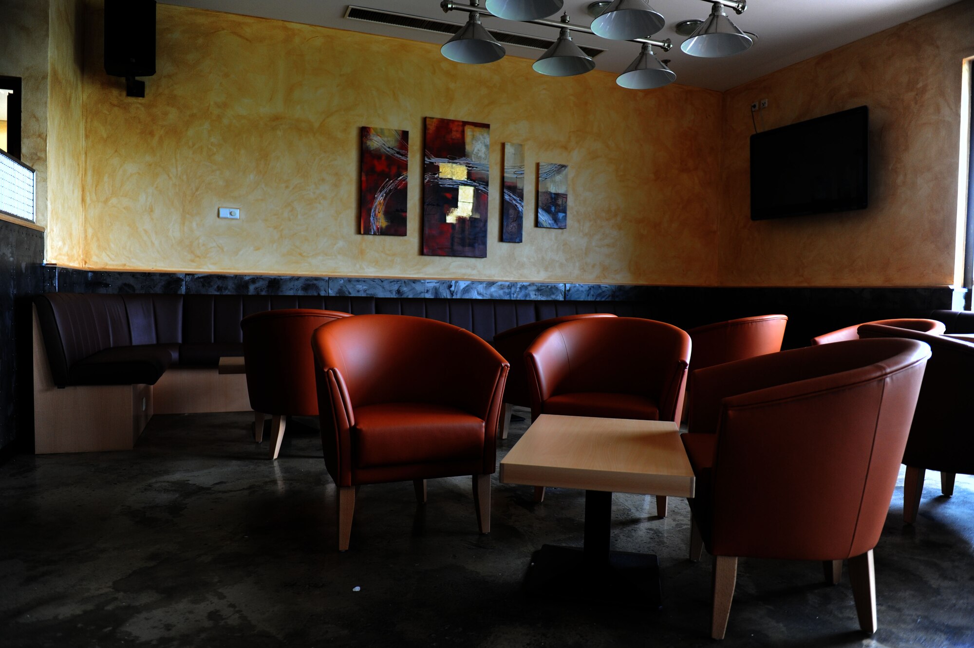 SPANGDAHLEM AIR BASE, Germany -- Eifel Grind, a European style café, opens 11 a.m. July 17 in Club Eifel here.  Located in what was once the officer’s section of Club Eifel, the café is designed for a jazz-like atmosphere and offers coffee, indoor and outdoor seating, free wireless internet and live entertainment Friday and Saturday nights. (U.S. Air Force photo by Airman 1st Class Gustavo Castillo/Realesed)  
