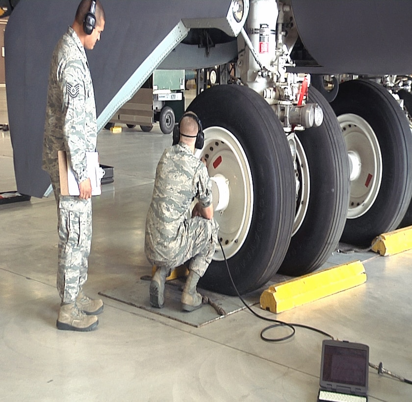 An Airman from the 362nd TRS connects a hose to the tire of a B-52 in order to monitor pressure and settings while doing a maintenance check. The 362nd TRS B-52 Aerospace Maintenance Apprentice course teaches Airmen the fundamentals of becoming a B-52 Crew Chief. (U.S. Air Force Photo/Josh Wilson) 