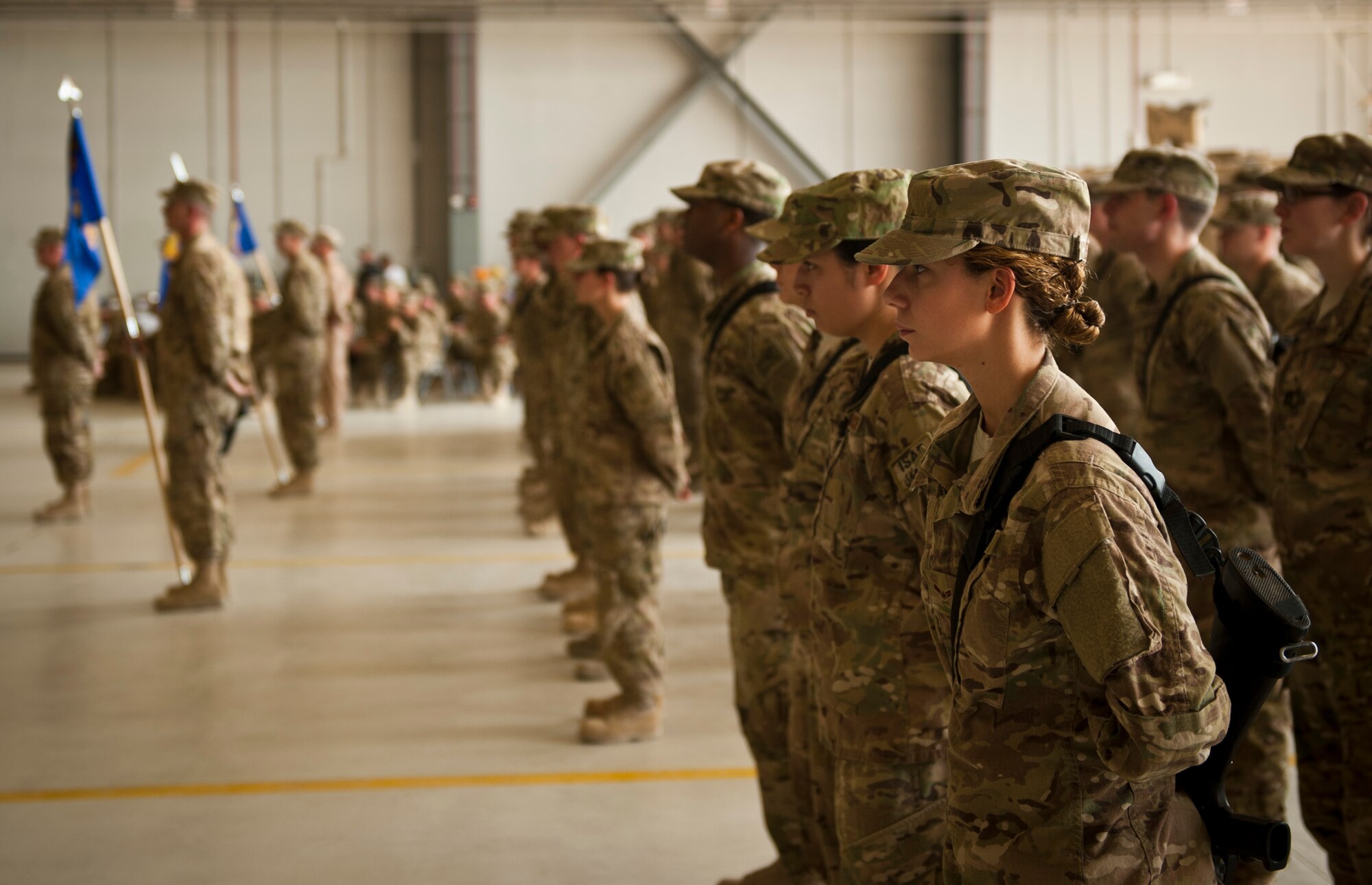 Airmen from the 455th Air Expeditionary Wing stand in formation awaiting the 455 AEW change of command ceremony at Bagram Airfield, Afghanistan, July 12, 2012. Maj. Gen. H. D. Polumbo, 9th Air Expeditionary Task Force-Afghanistan commander, presided over the ceremony in which Brig. Gen. Thomas Deale relinquished command and Brig. Gen. Joseph Guastella assumed command. (U.S. Air Force Photo/Capt. Raymond Geoffroy)