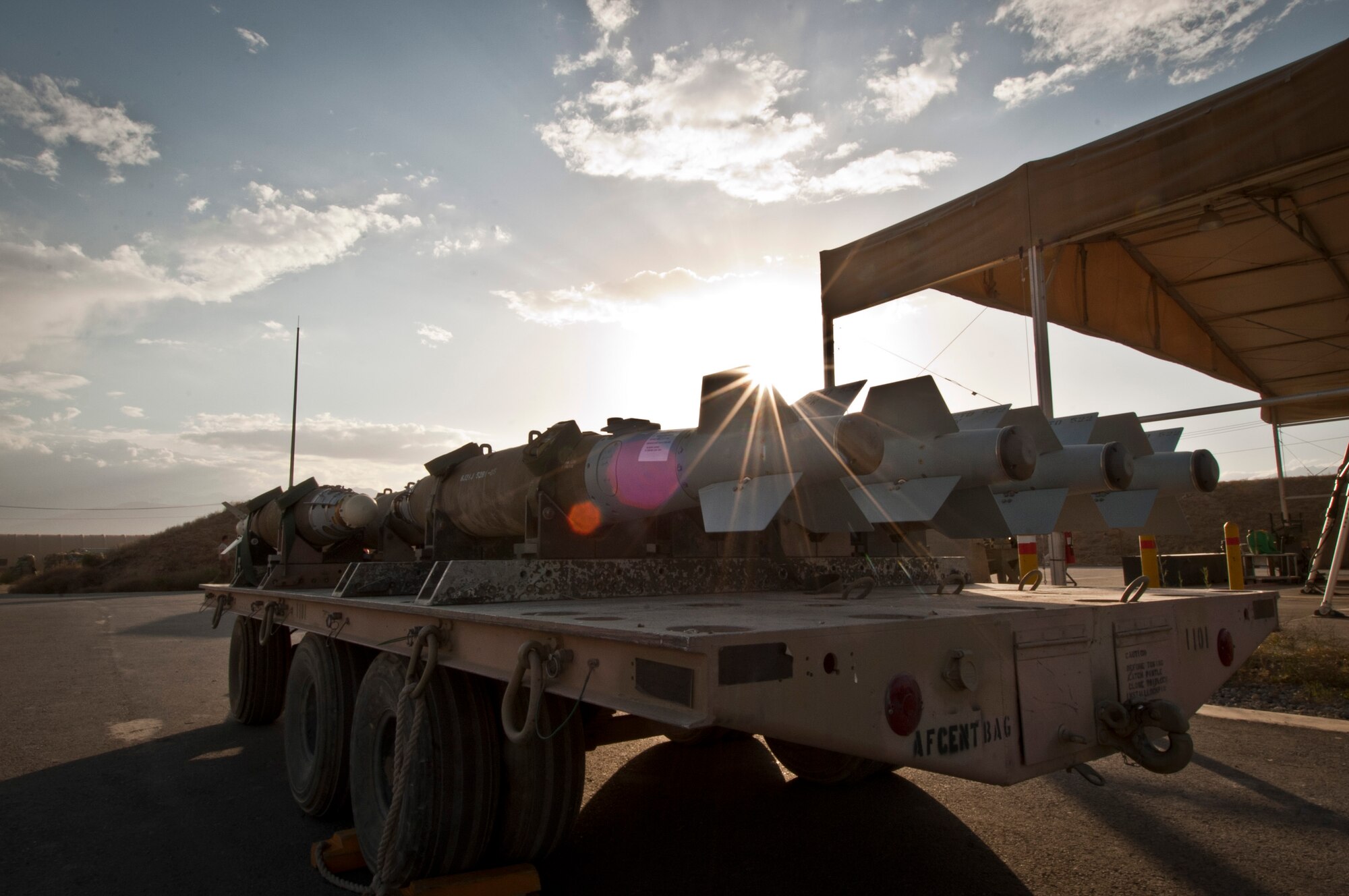 A shipment of GBU-38 smart bombs assembled by the 455th Maintenance Squadron, sit on a trailer ready to be delivered to aircraft at Bagram Airfield, Afghanistan, June 23, 2012. 455 MXS Munitions Airmen work 24/7 to provide the ammo used by Bagram aircraft to defeat insurgents and protect friendly forces in Afghanistan. (U.S. Air Force photo/Capt. Raymond Geoffroy)