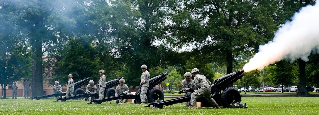 Soldiers from the 7th Sustainment Brigade Salute Battery fire 35-millimeter cannons during the Independence Day celebration at Seay Plaza, Ft. Eustis, Va., July 4, 2012. One shot was fired for each state in the union. As the rounds were fired, a narrator announced the name and date of accession of each state. (U.S. Air Force photo by Senior Airman John D. Strong II/Released)