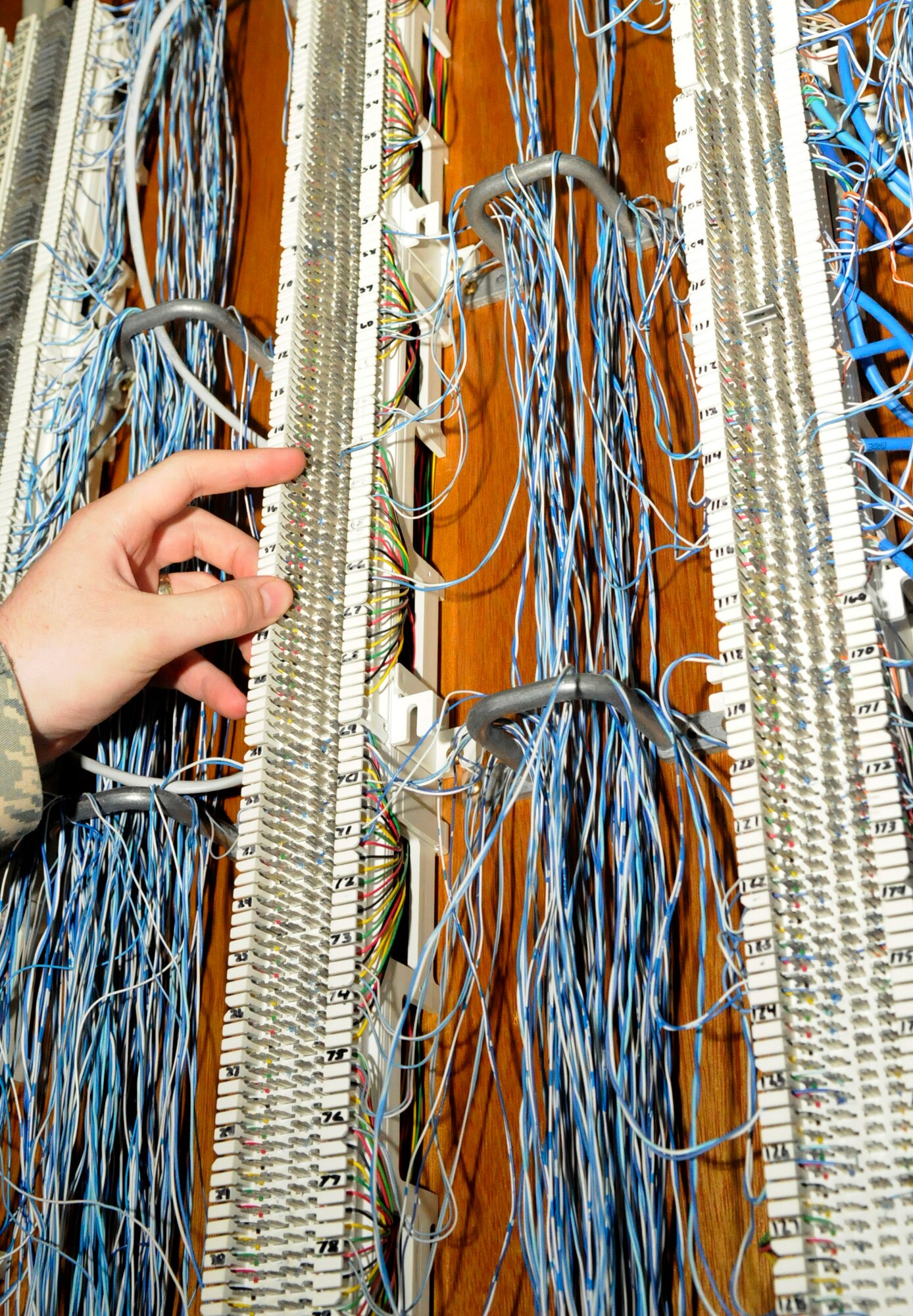 A telephone circuit is organized to pinpoint phone areas throughout the base on Kadena Air Base, Japan, July 10, 2012. The Operations Flight makes sure roughly 22,000 personnel on base, including 22 partner units, have core communications, including computer and phone access. (U.S. Air Force photo/Airman Tara A. Williamson)